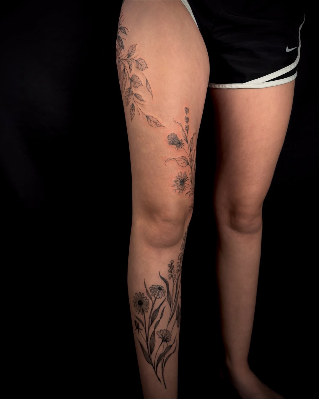 Floral arrangement black and grey tattoo on the calf by ollie b ⋆⟡⋆, Dayton, Ohio
