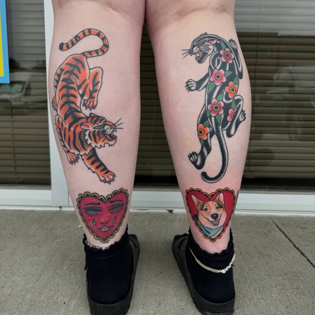 Tiger and panther American traditional tattoo on the leg by Kaley, Des Moines, Iowa
