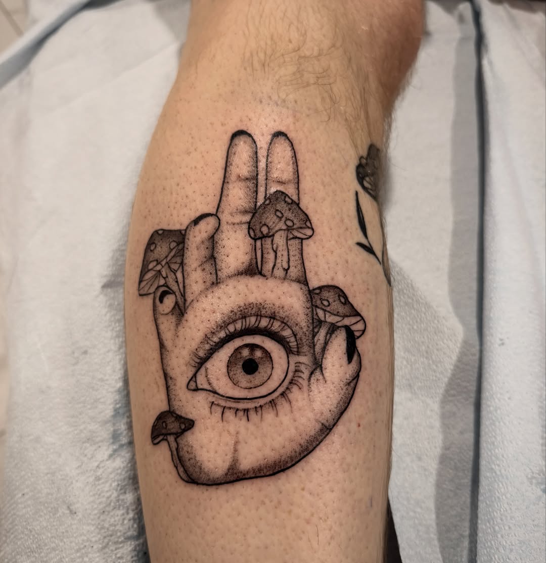 Eye and hand dotwork tattoo on the forearm by Shannon Misitano