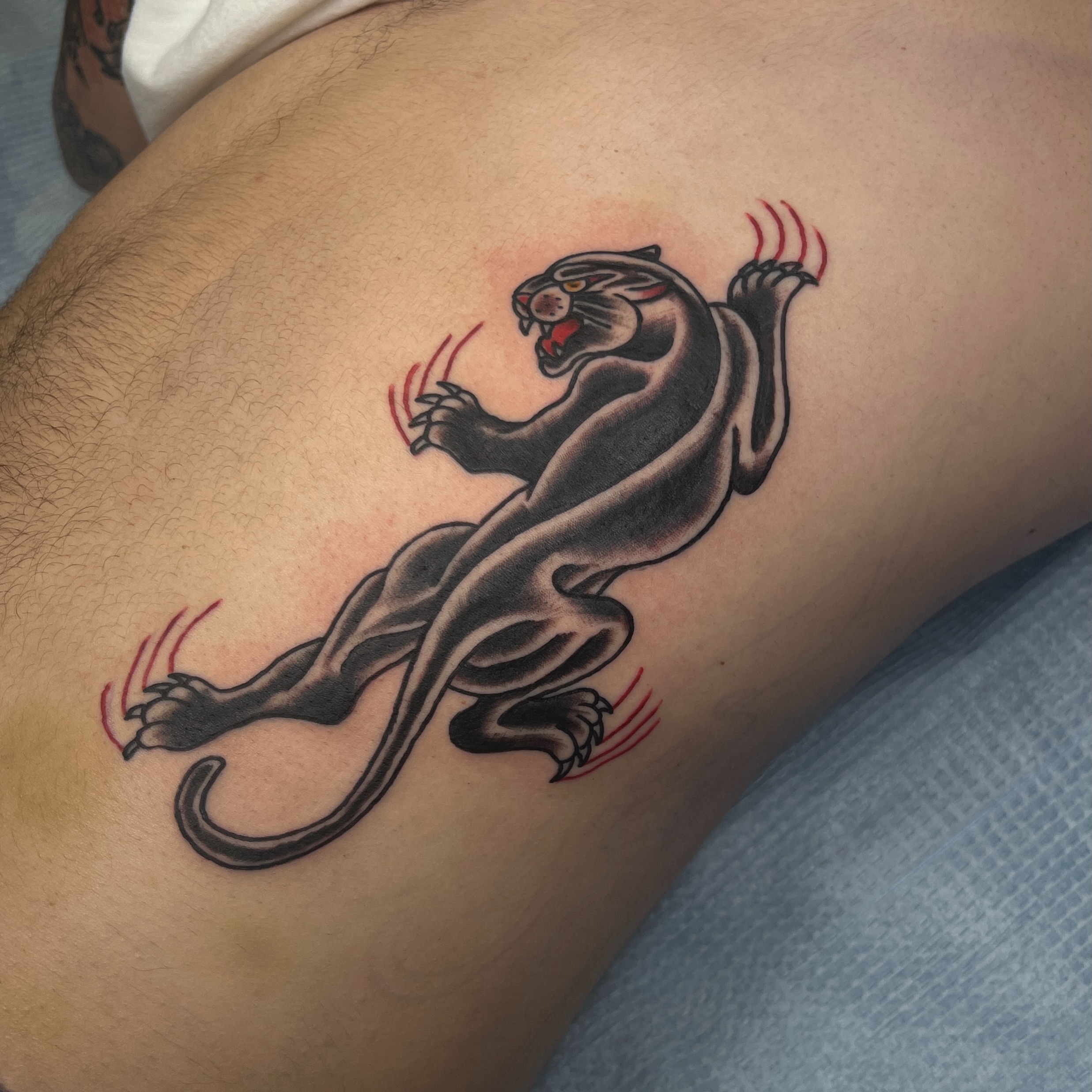 Panther American traditional tattoo on the thigh by Brian Mock
