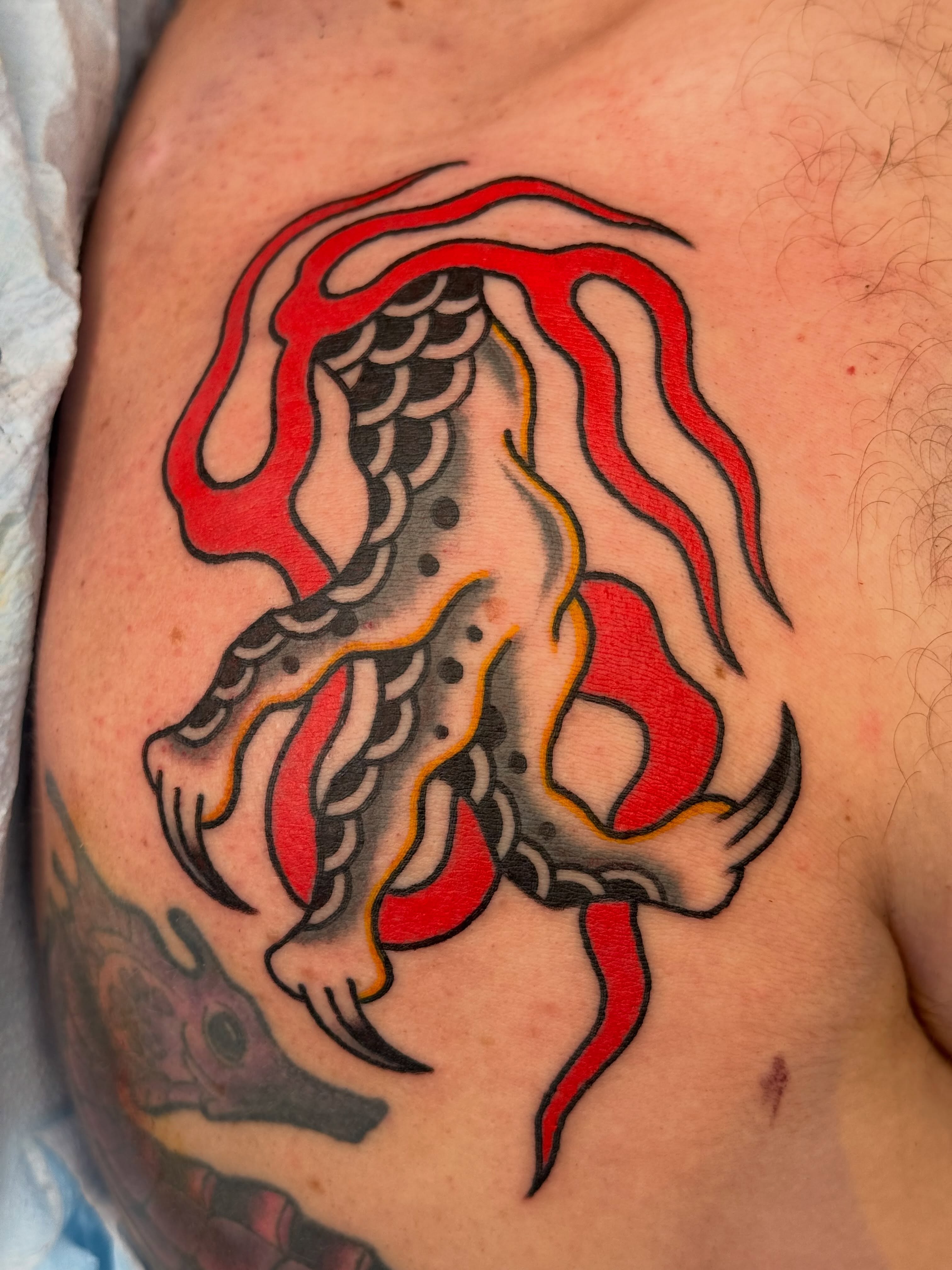 Octopus American traditional tattoo on the chest by Emma Eaton