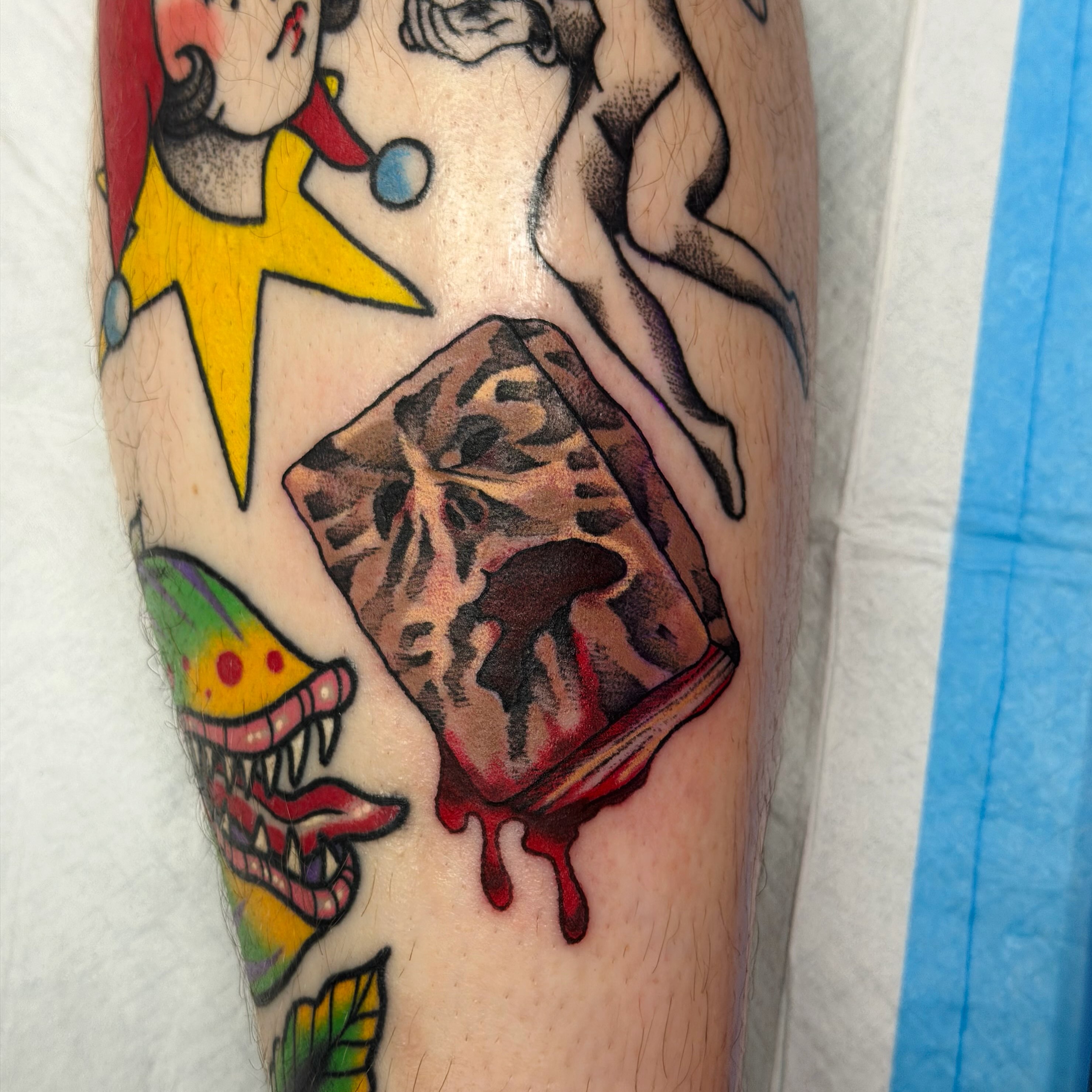 Jester and mushroom American traditional tattoo on the forearm by Emily