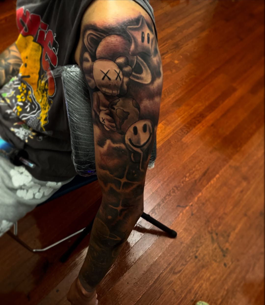 Teddy bear and jack-o'-lantern black and grey tattoo on the forearm by Lamb, Philadelphia, Pennsylvania