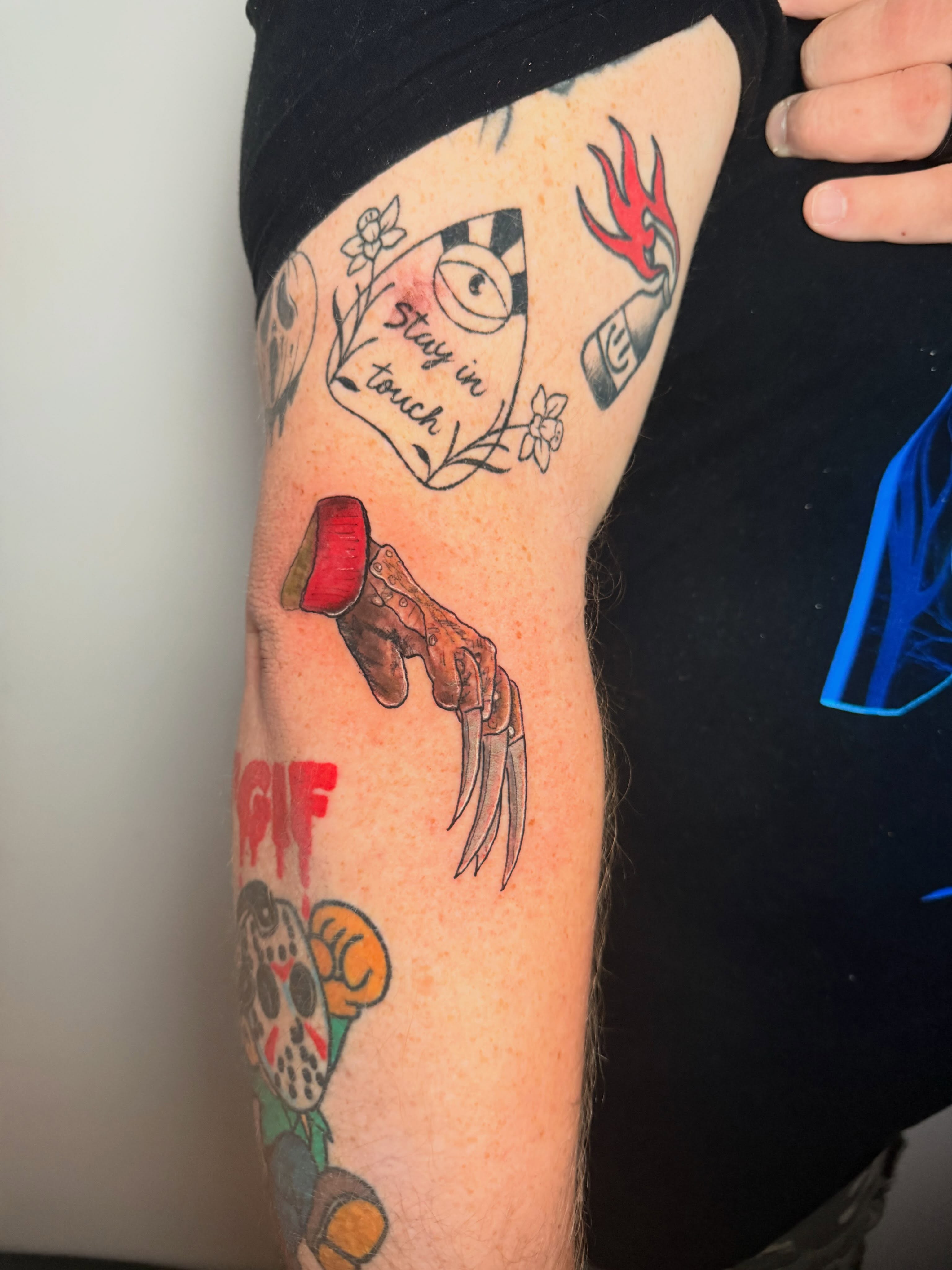 Fingers and glove American traditional tattoo on the forearm by Gabrielle Frelak, York, Pennsylvania