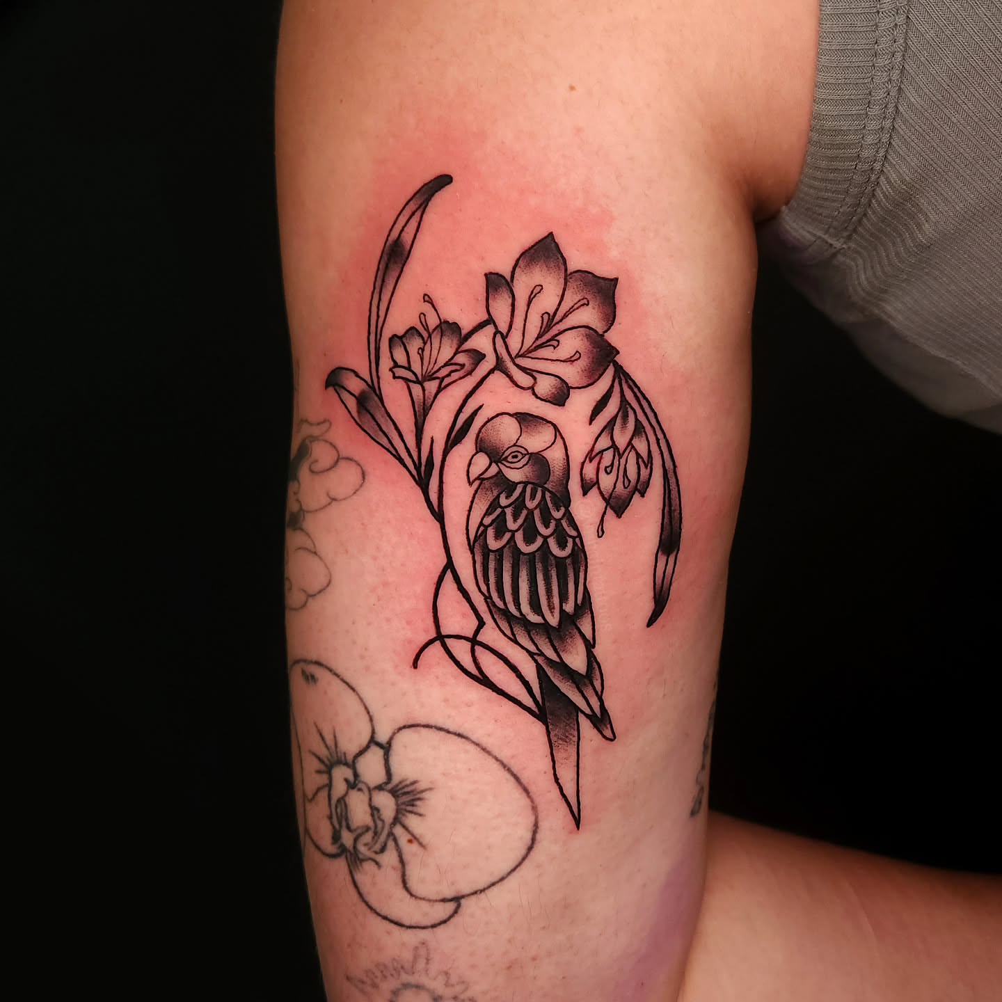 Bird and flowers black and grey tattoo on the forearm by Sheena Yu-Hsin Wood
