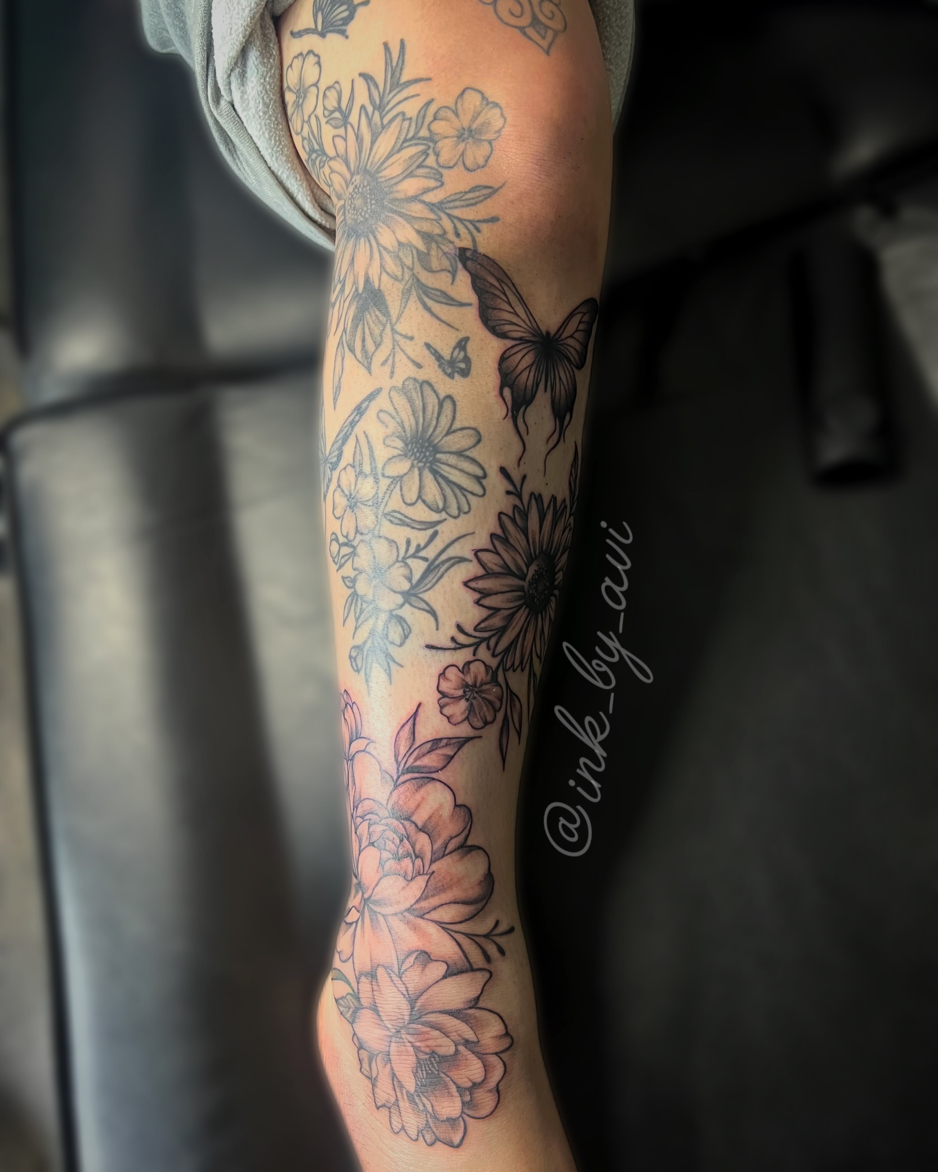 Floral bouquet black and grey tattoo on the forearm by Avi, Cleveland, Ohio