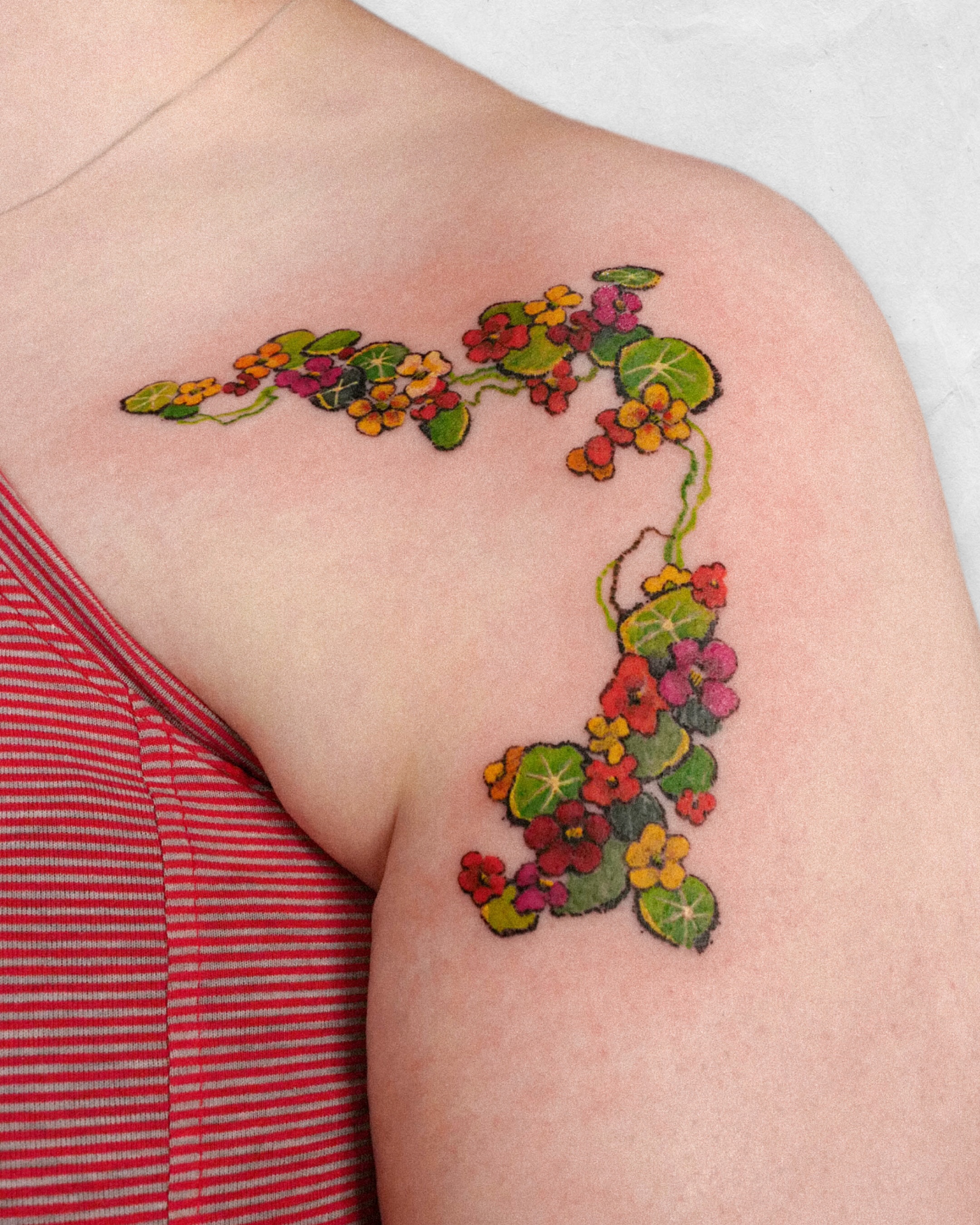Flower vine watercolor tattoo on the shoulder by dahye lee