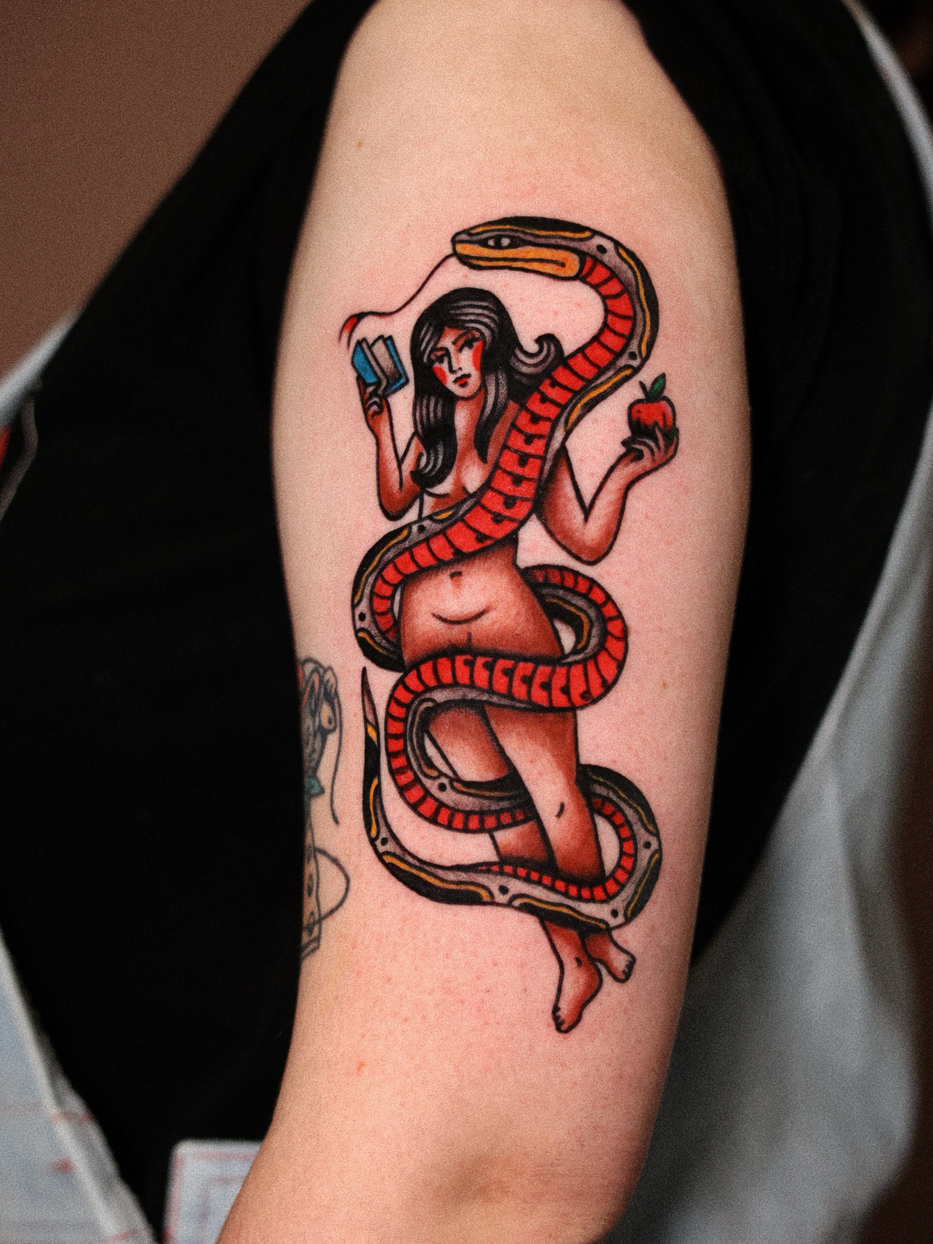 Snake and woman American traditional tattoo on the forearm by Dylan Mott