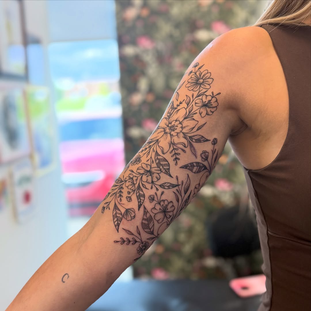 Floral bouquet black and grey tattoo on the forearm by ✨olivia