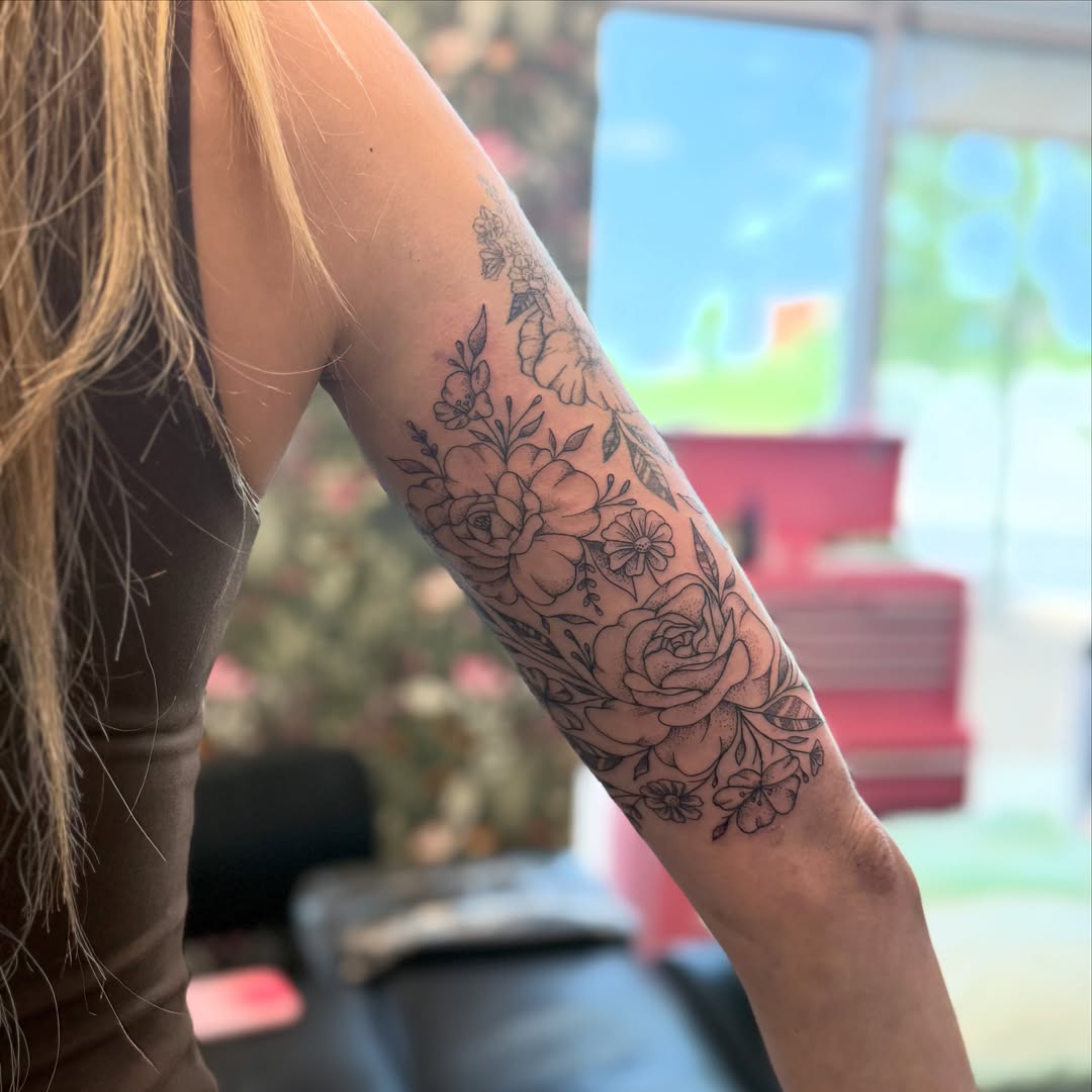 Floral bouquet black and grey tattoo on the forearm by ✨olivia