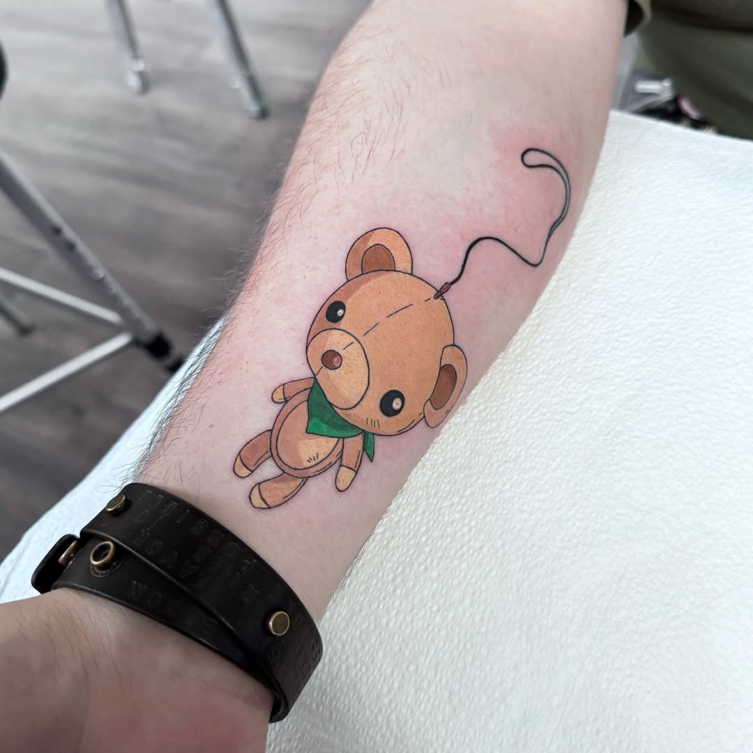 Teddy bear illustrative tattoo on the forearm by @nudylicioustattoos