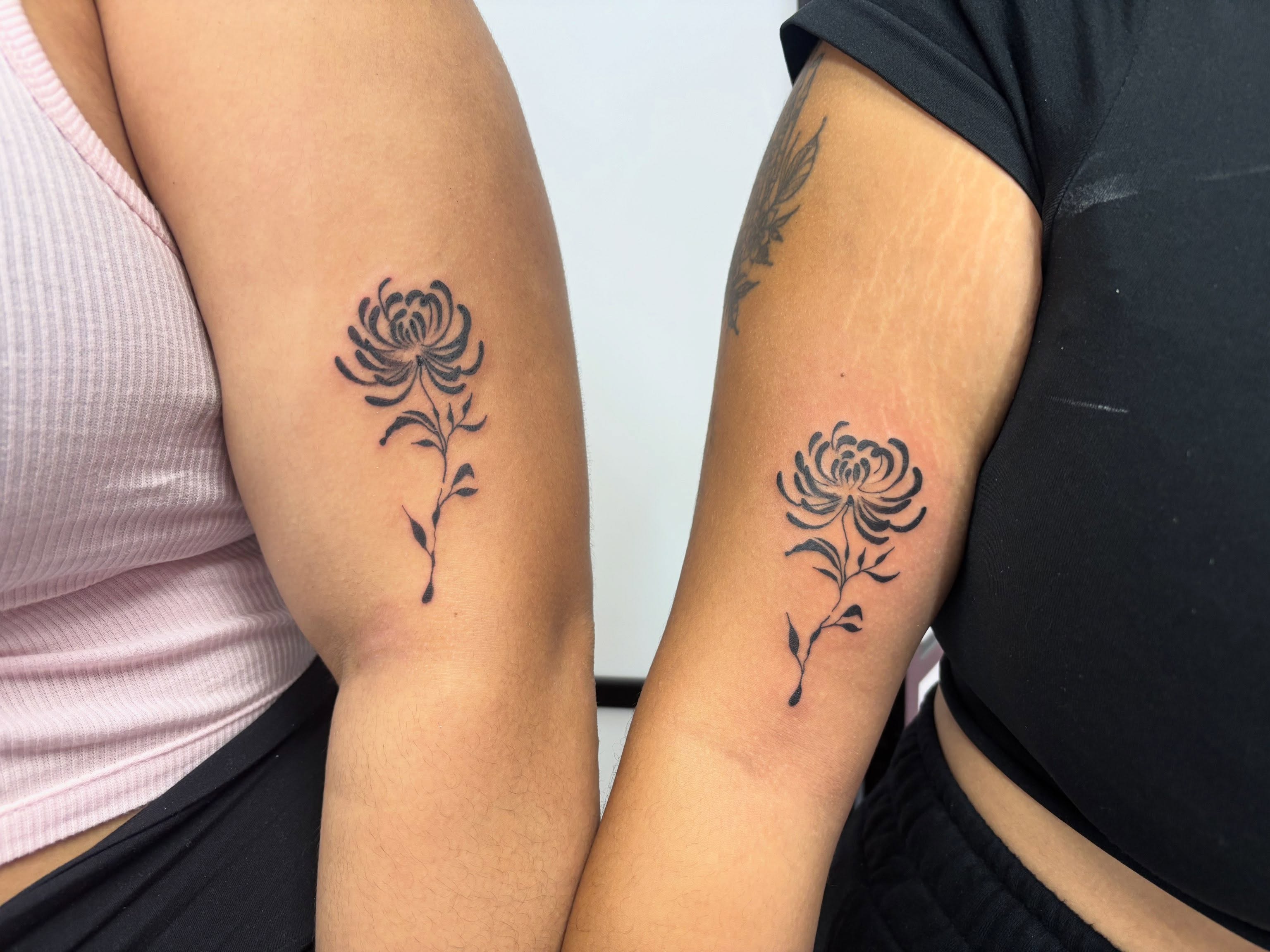 Chrysanthemum black and grey tattoo on the forearm by Mickey