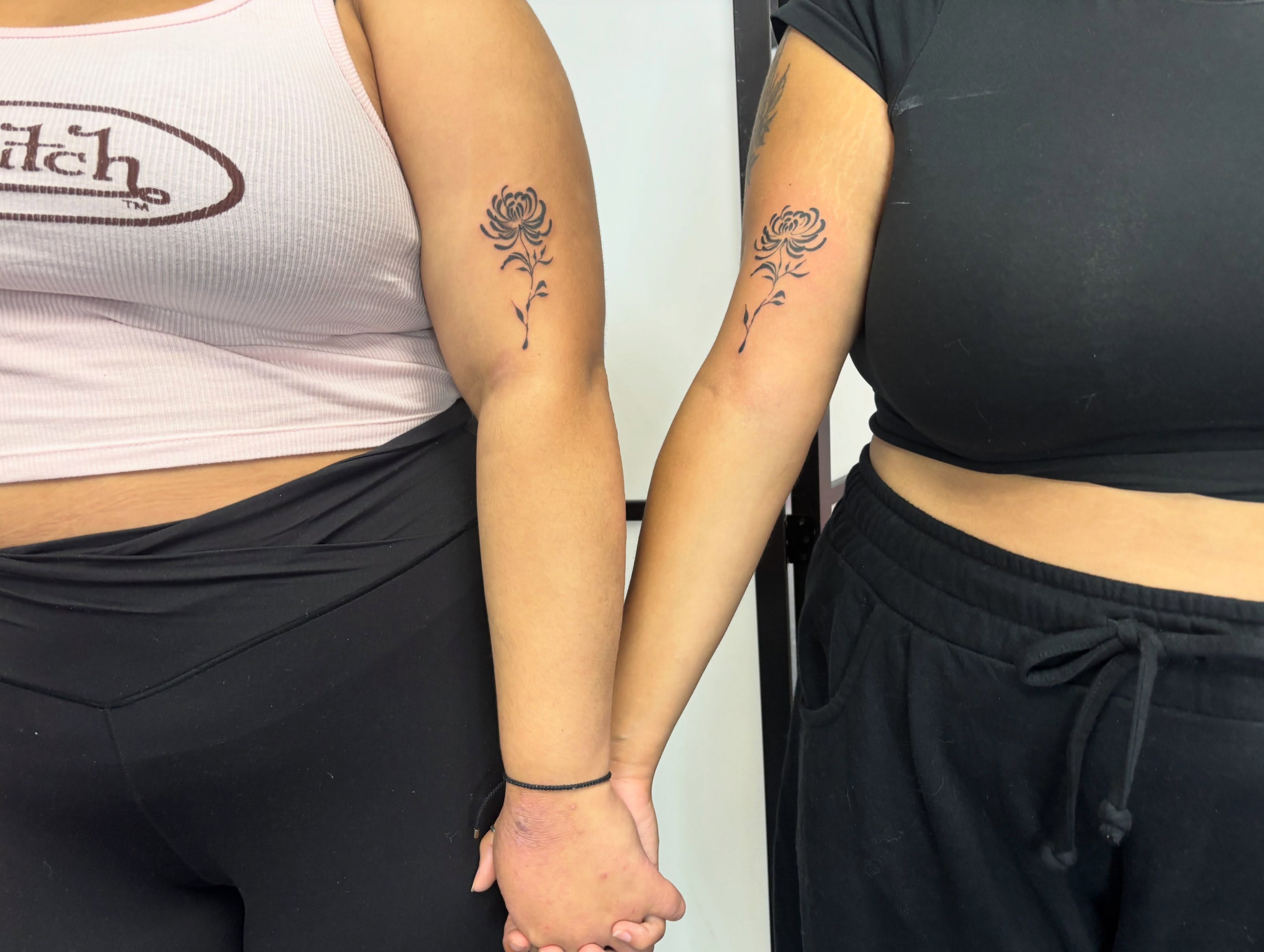Flower black and grey tattoo on the forearm by Mickey