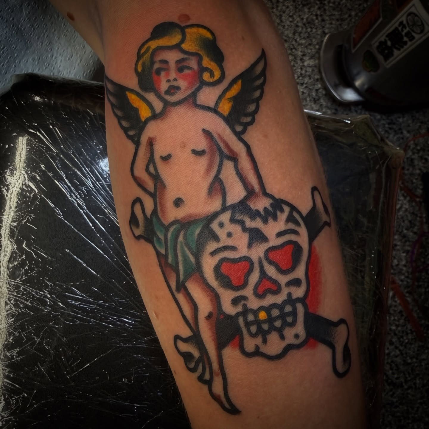 Angel and skull American traditional tattoo on the forearm by Chuck Paprocki, Nashville, Tennessee