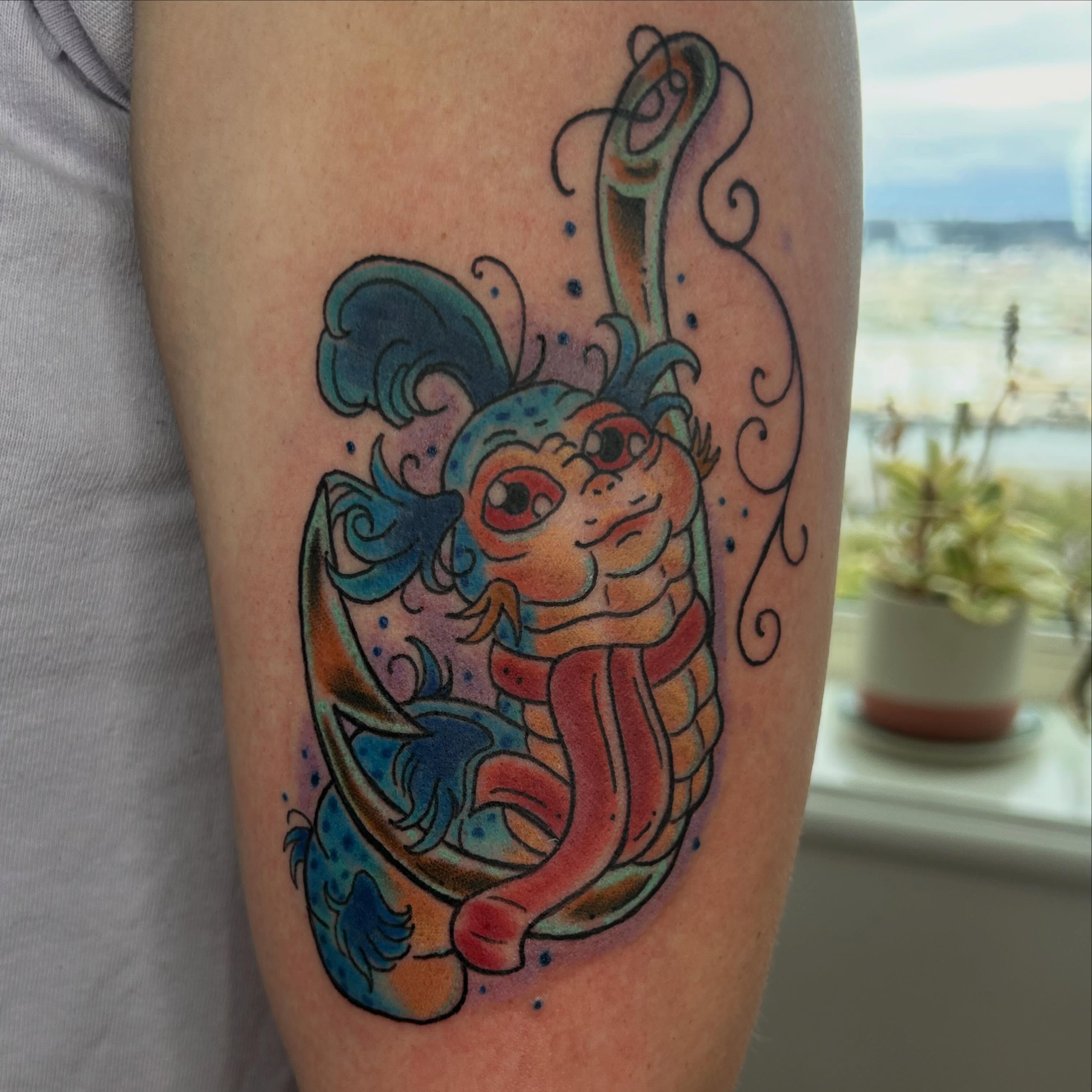 Koi fish new school tattoo on the forearm by Reilley Earles