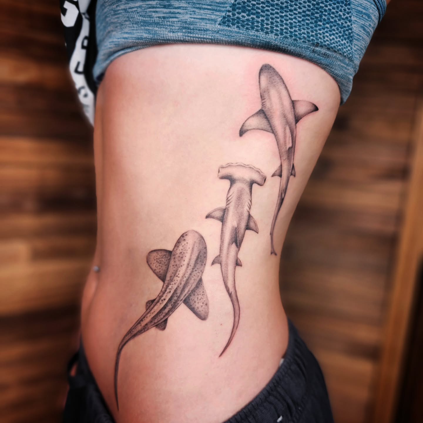 Sharks realism tattoo on the thigh by Kelly Zito