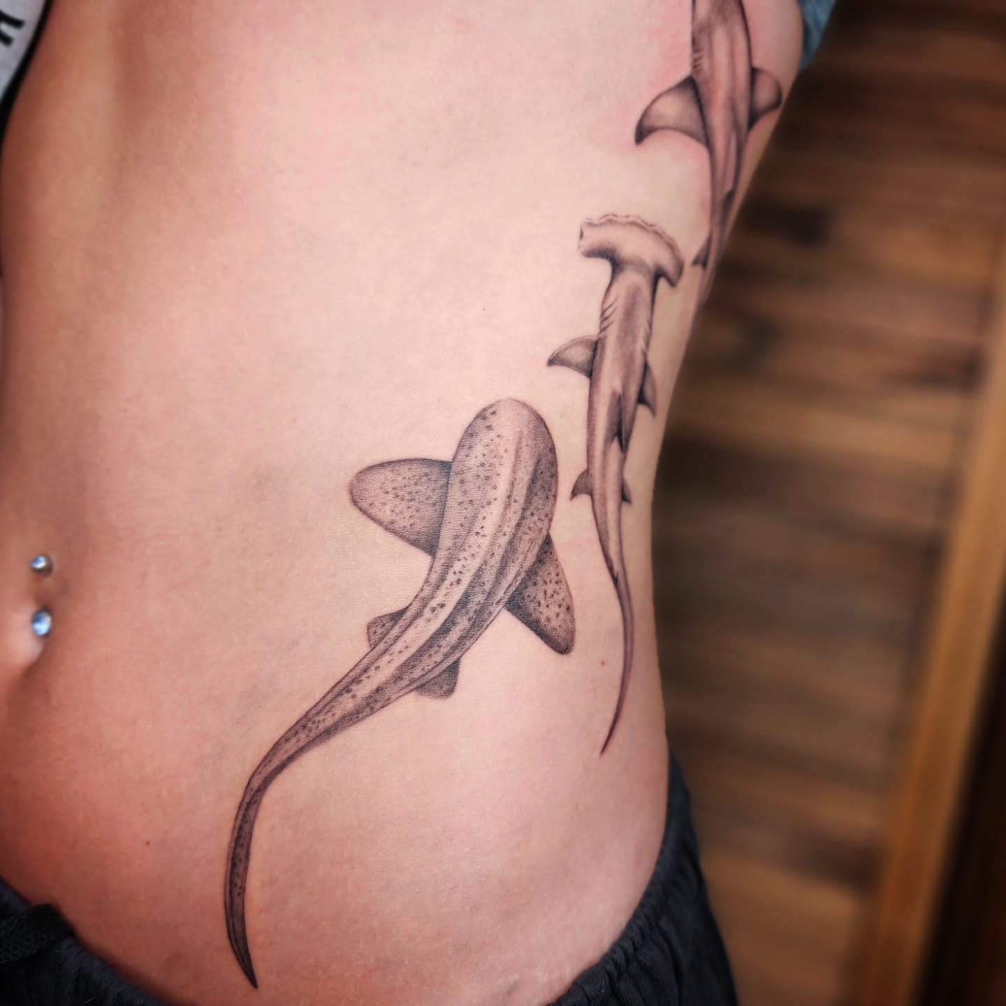 Shark dotwork tattoo on the ribs by Kelly Zito