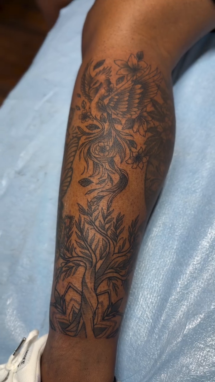 Eagle and floral elements realism tattoo by H.G