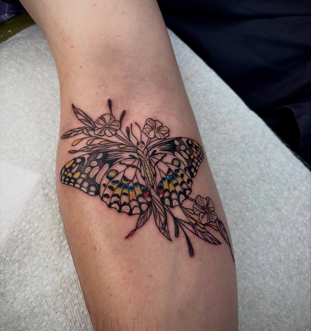 Butterfly and flowers realism tattoo on the forearm by destiney rose