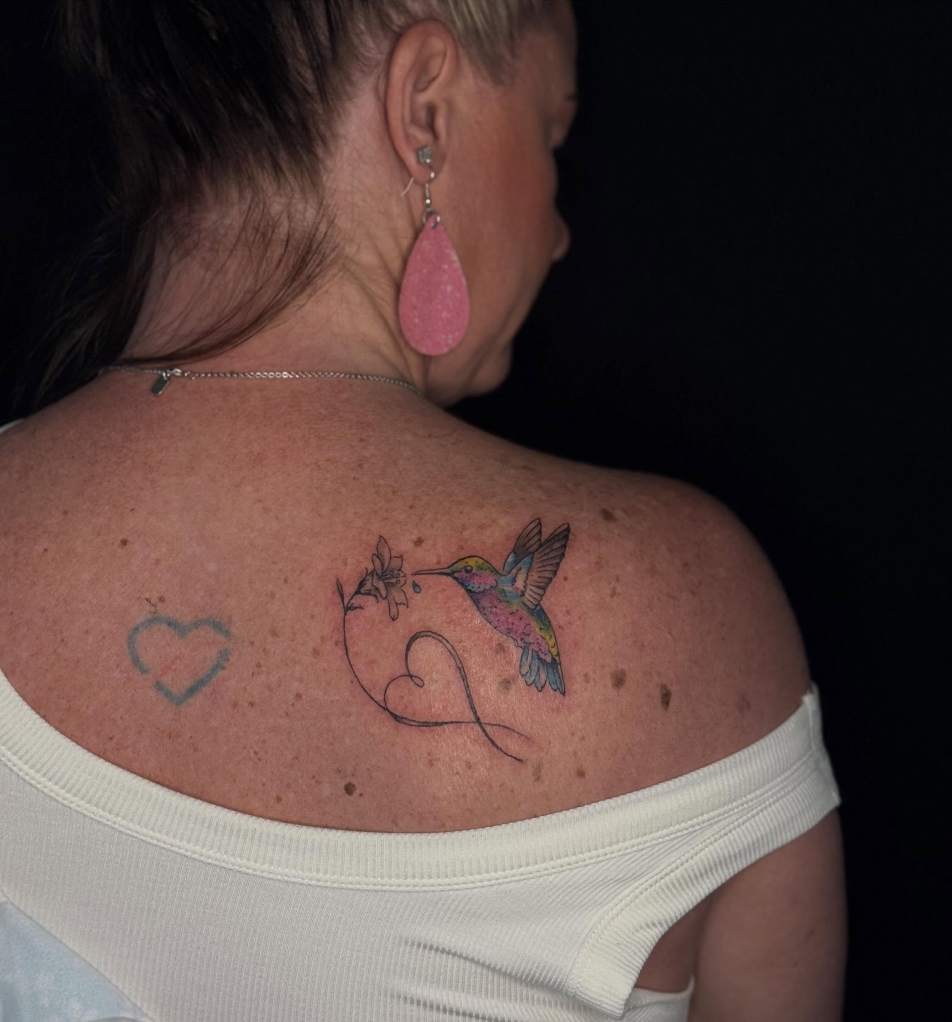 Hummingbird and flower new school tattoo on the shoulder by Houston Tattoo Artist