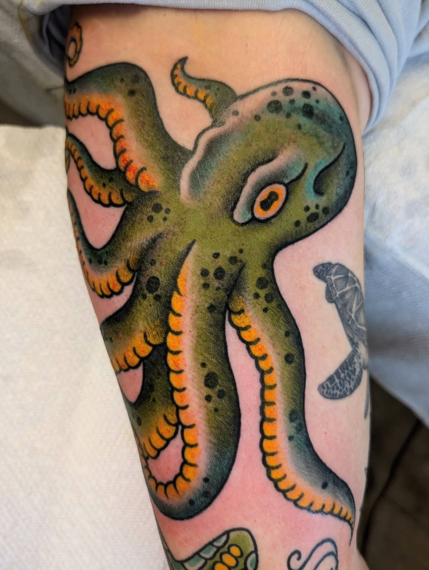 Octopus American traditional tattoo on the forearm by Erik O'Steen, Medford, Massachusetts