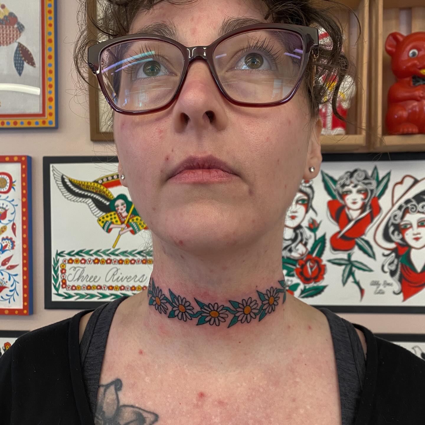 Daisy chain American traditional tattoo on the neck by Abby Rose Estes