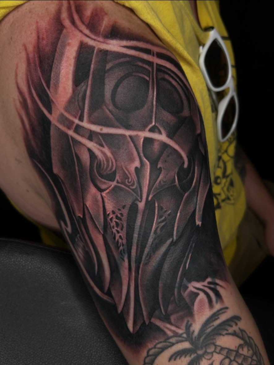 Mask dark realism tattoo on the forearm by Whitney Harbin