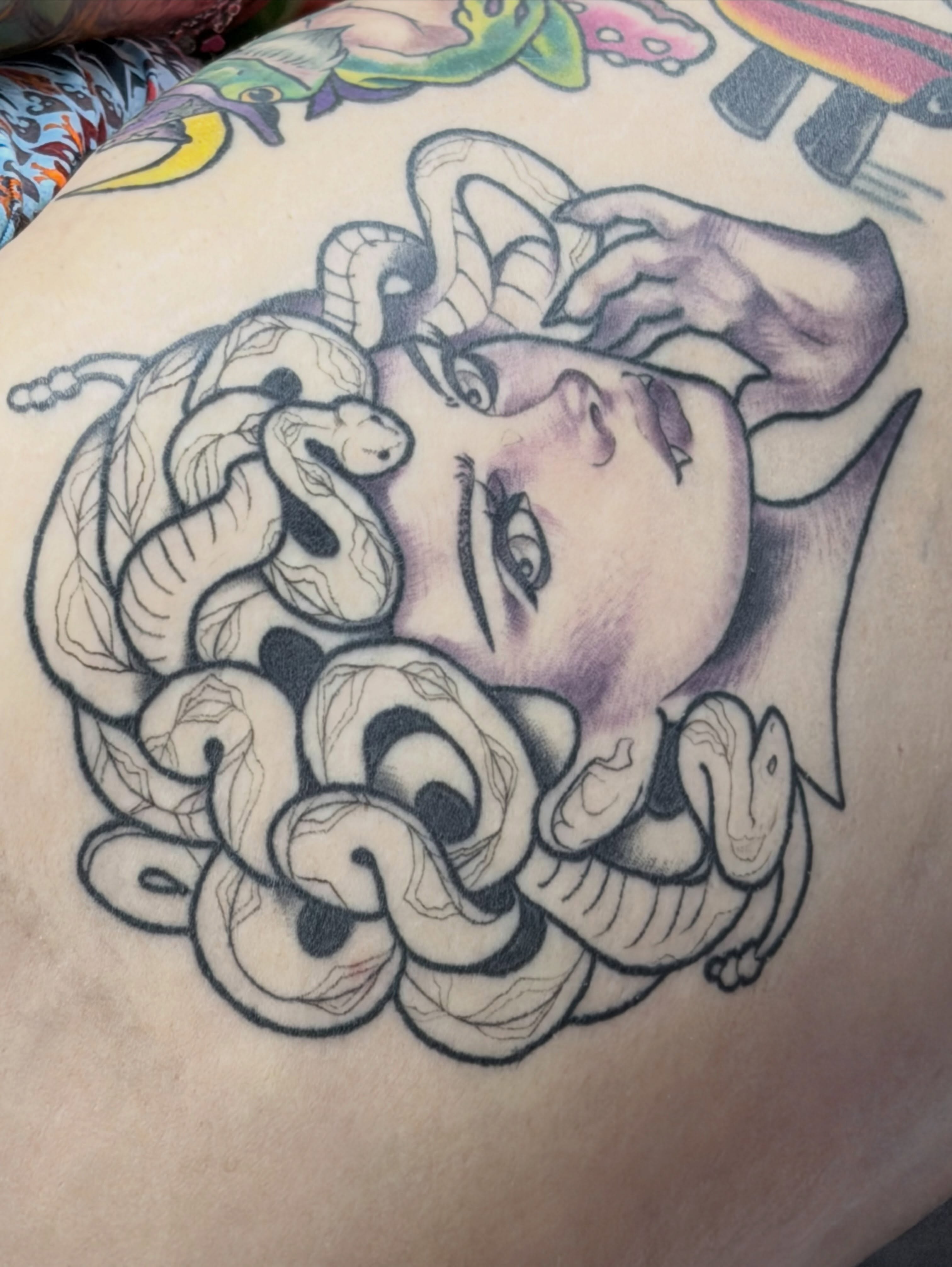 Medusa neo-traditional tattoo on the thigh by Ash Sansoucie