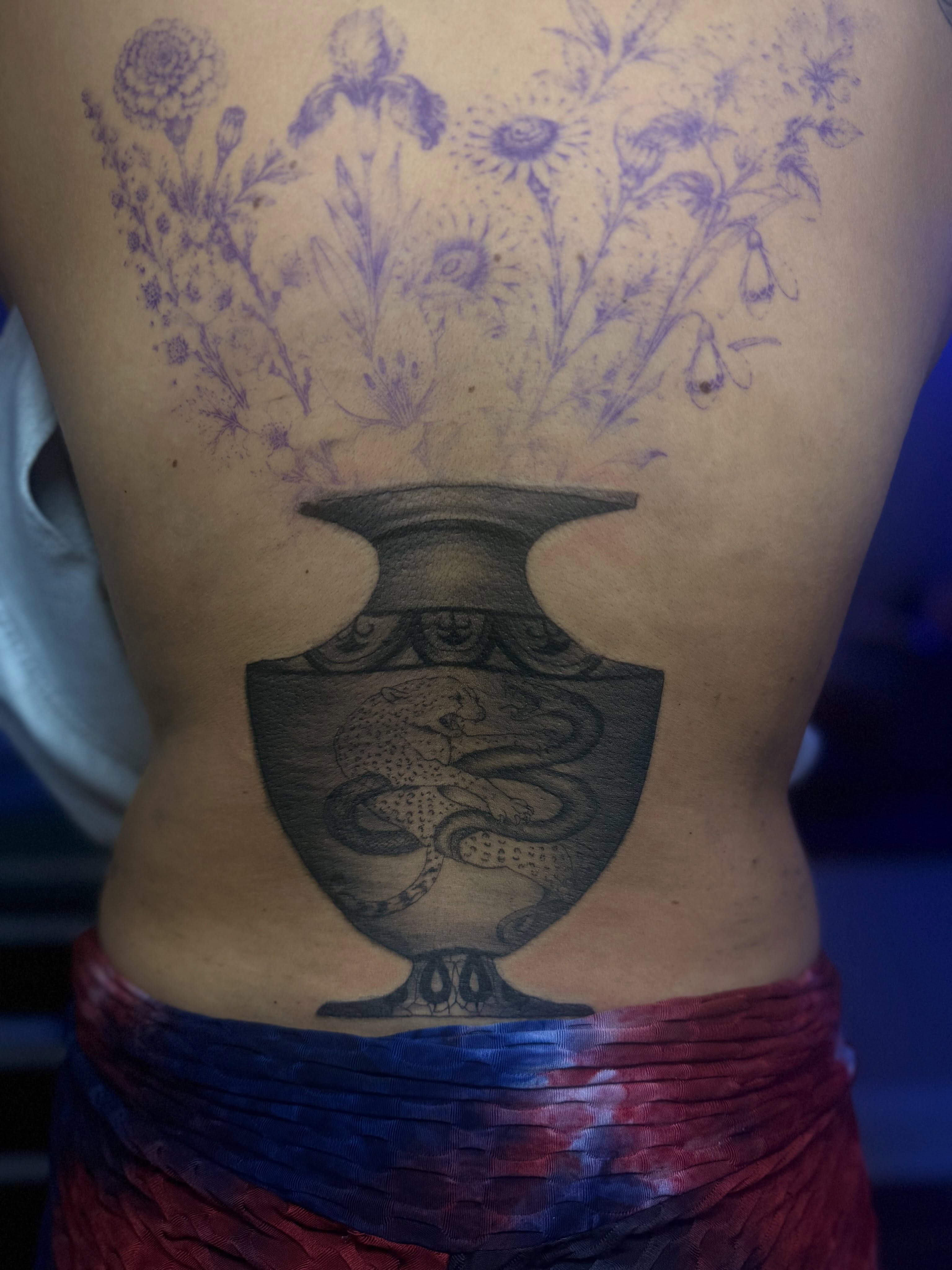 Urn with snake black and grey tattoo on the torso by Tattoos by Santos