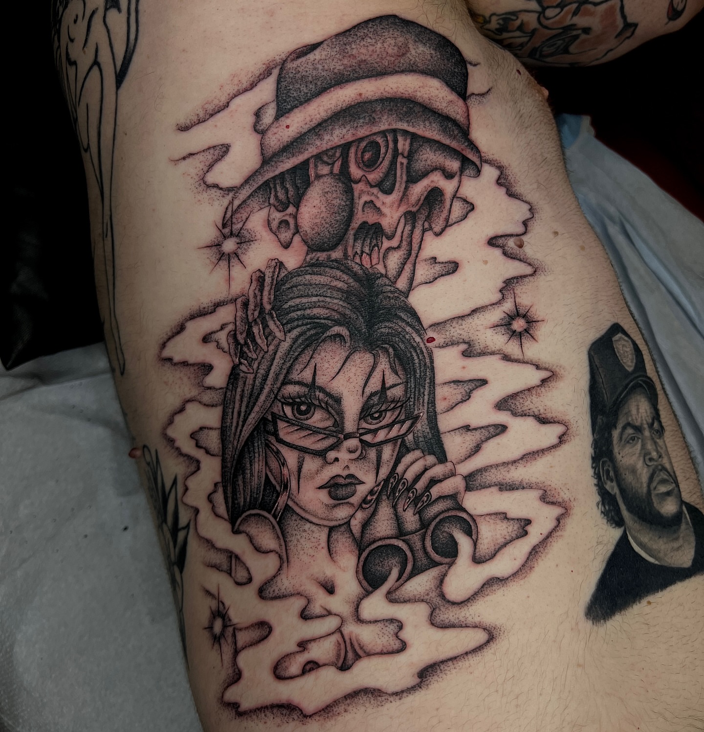 Woman with skull dotwork tattoo on the thigh by David Delacruz