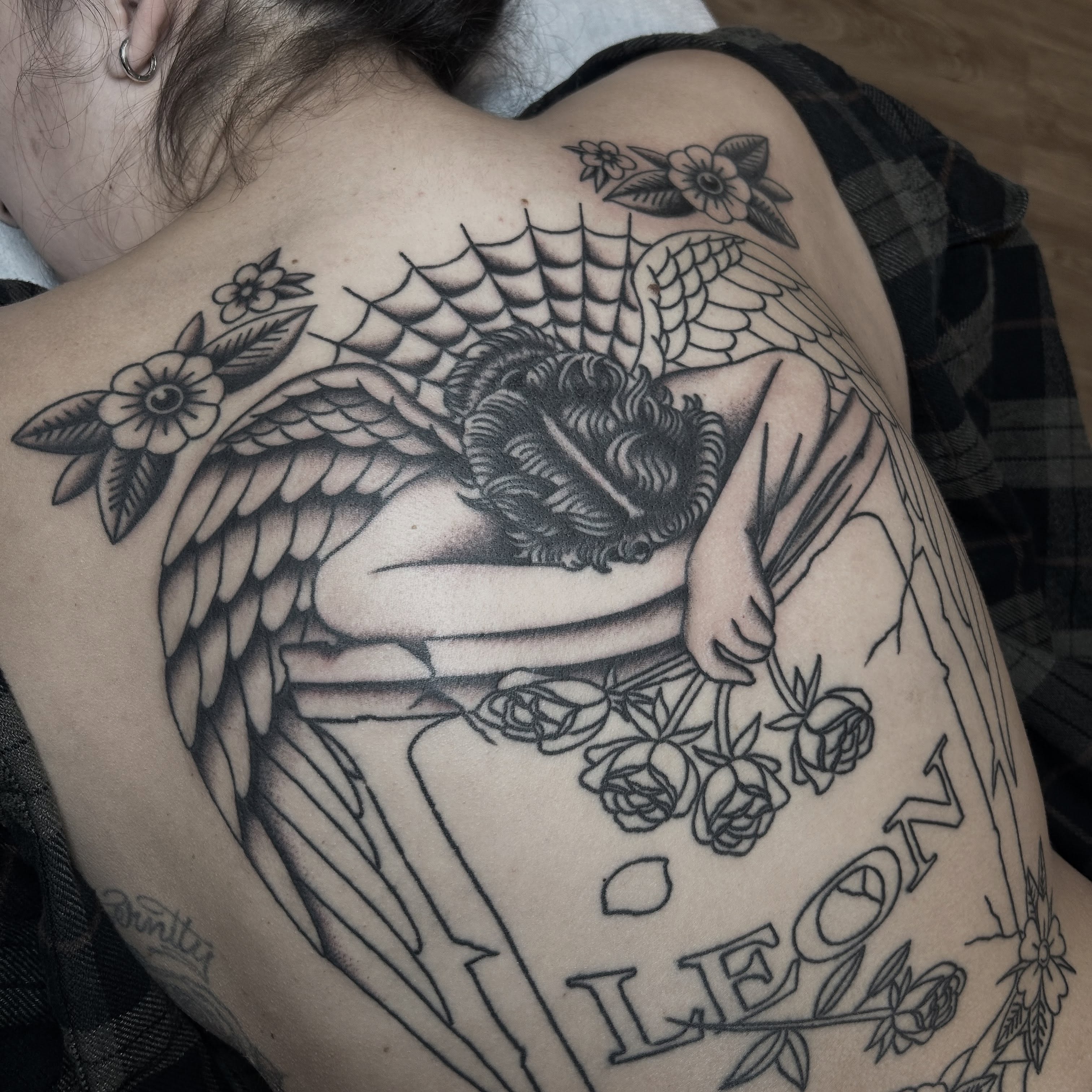 Swan and roses realism tattoo on the back by Stephen Sanchez