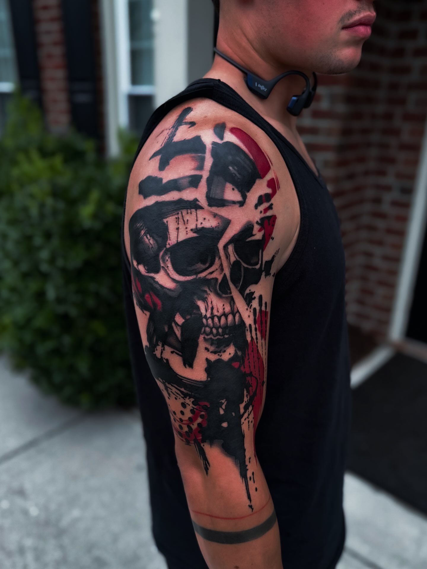 Skull realism tattoo on the upper arm by 𝔍𝔞𝔯𝔢𝔡 𝔞𝔩𝔩𝔢𝔫