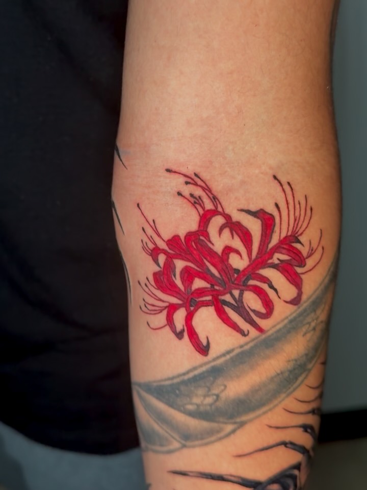 Red spider lily japanese irezumi tattoo on the forearm by Gigi