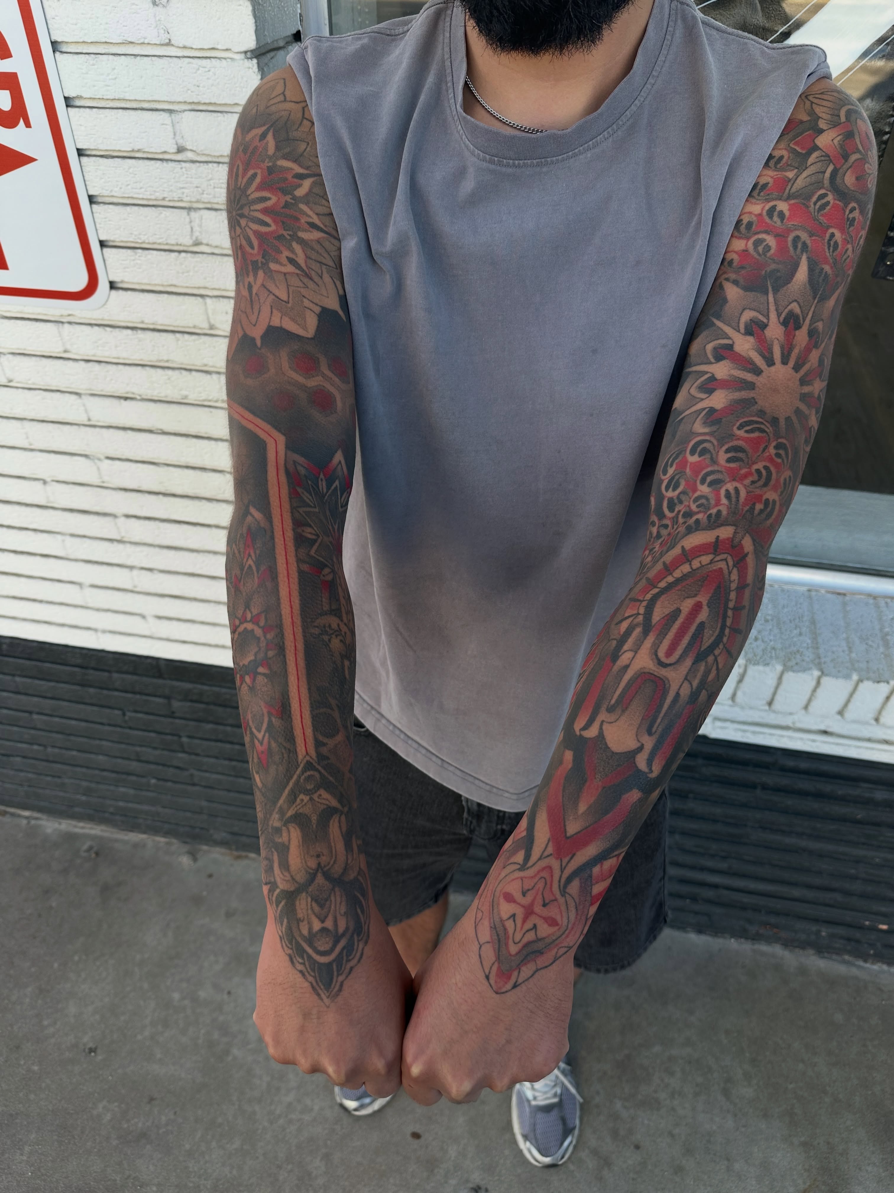 Full sleeve American traditional tattoo on the upper arm by Juan Vega (tony)