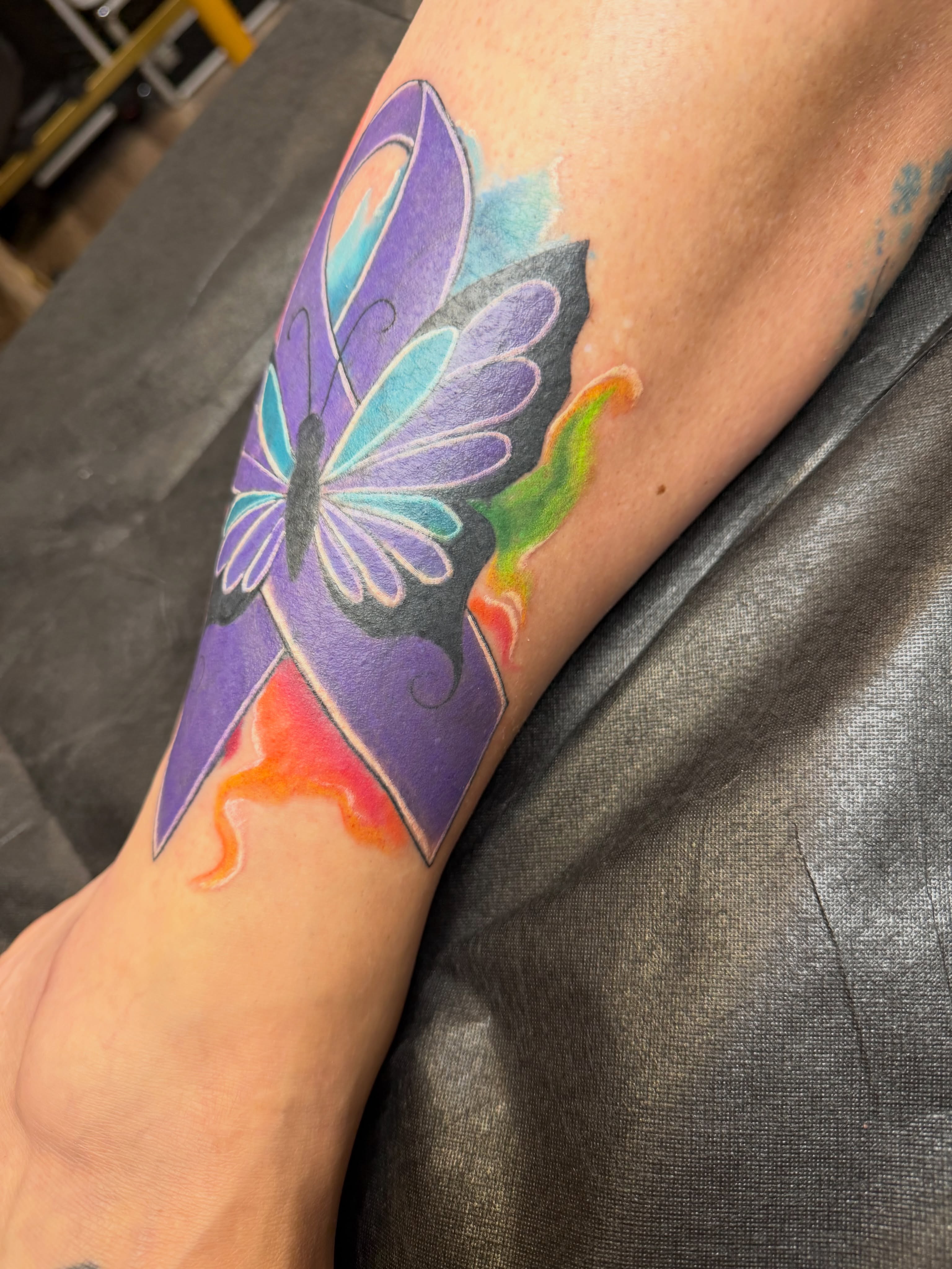 Butterfly new school tattoo on the forearm by Rain David