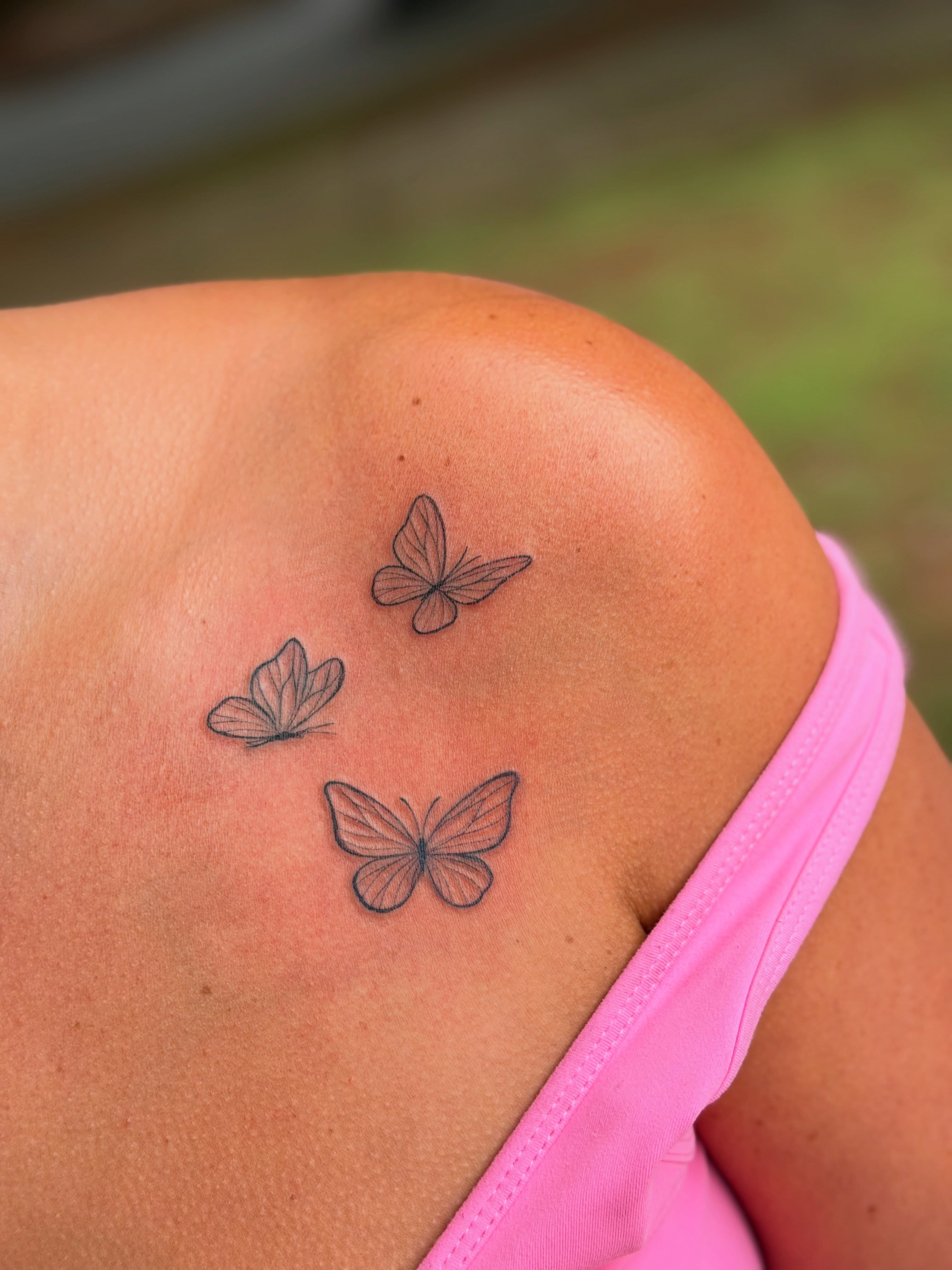 Butterflies dotwork tattoo on the shoulder by Emily Velletta, Huntersville, North Carolina