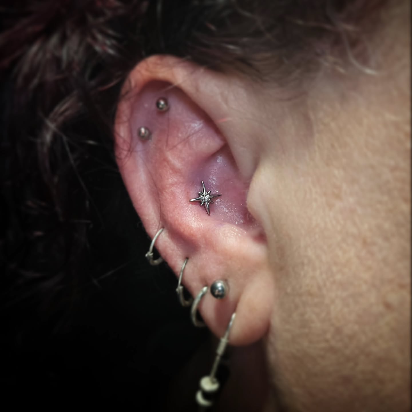 Ear piercing geometric tattoo by DFW