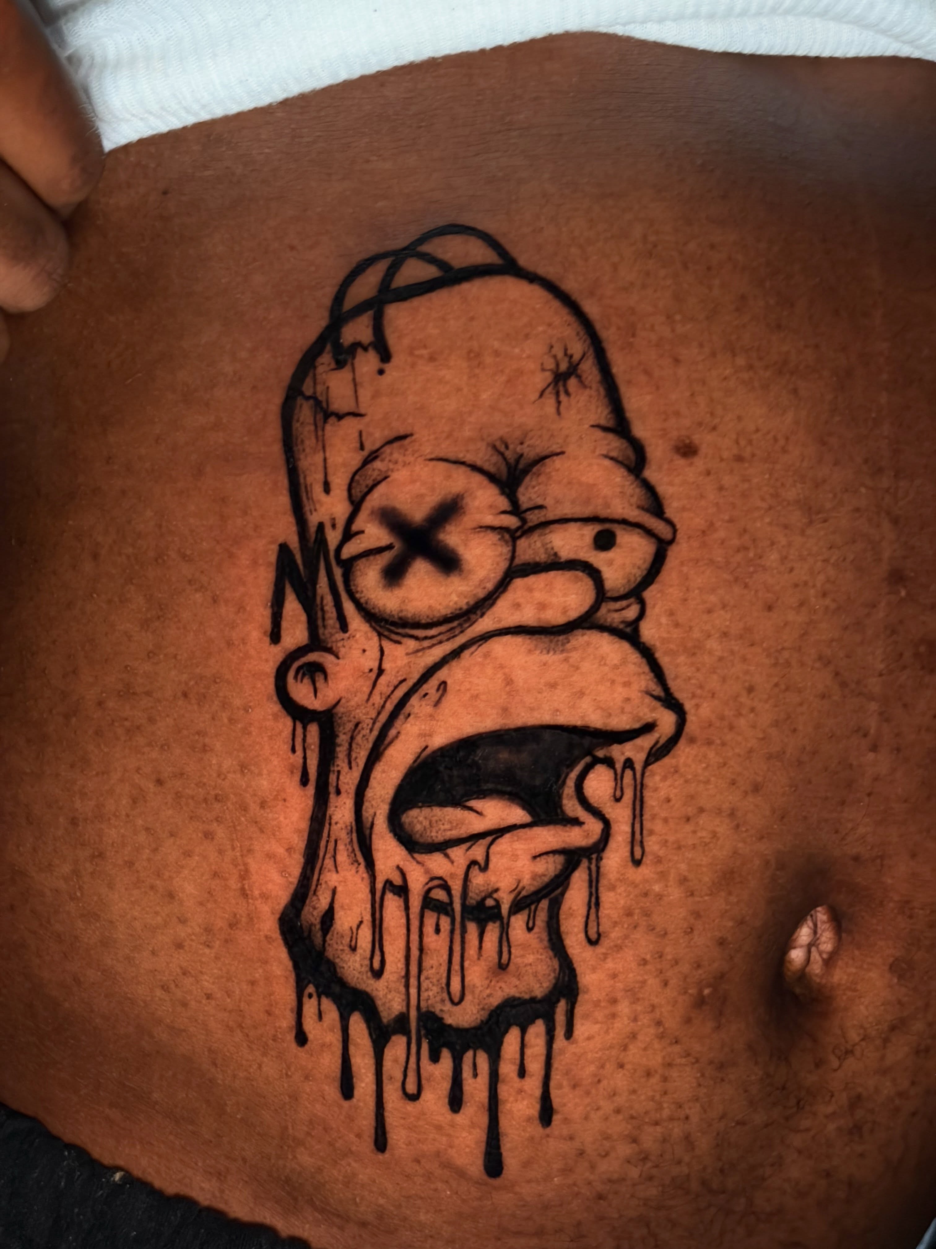 Homer Simpson dark realism tattoo by @getmoneetattz