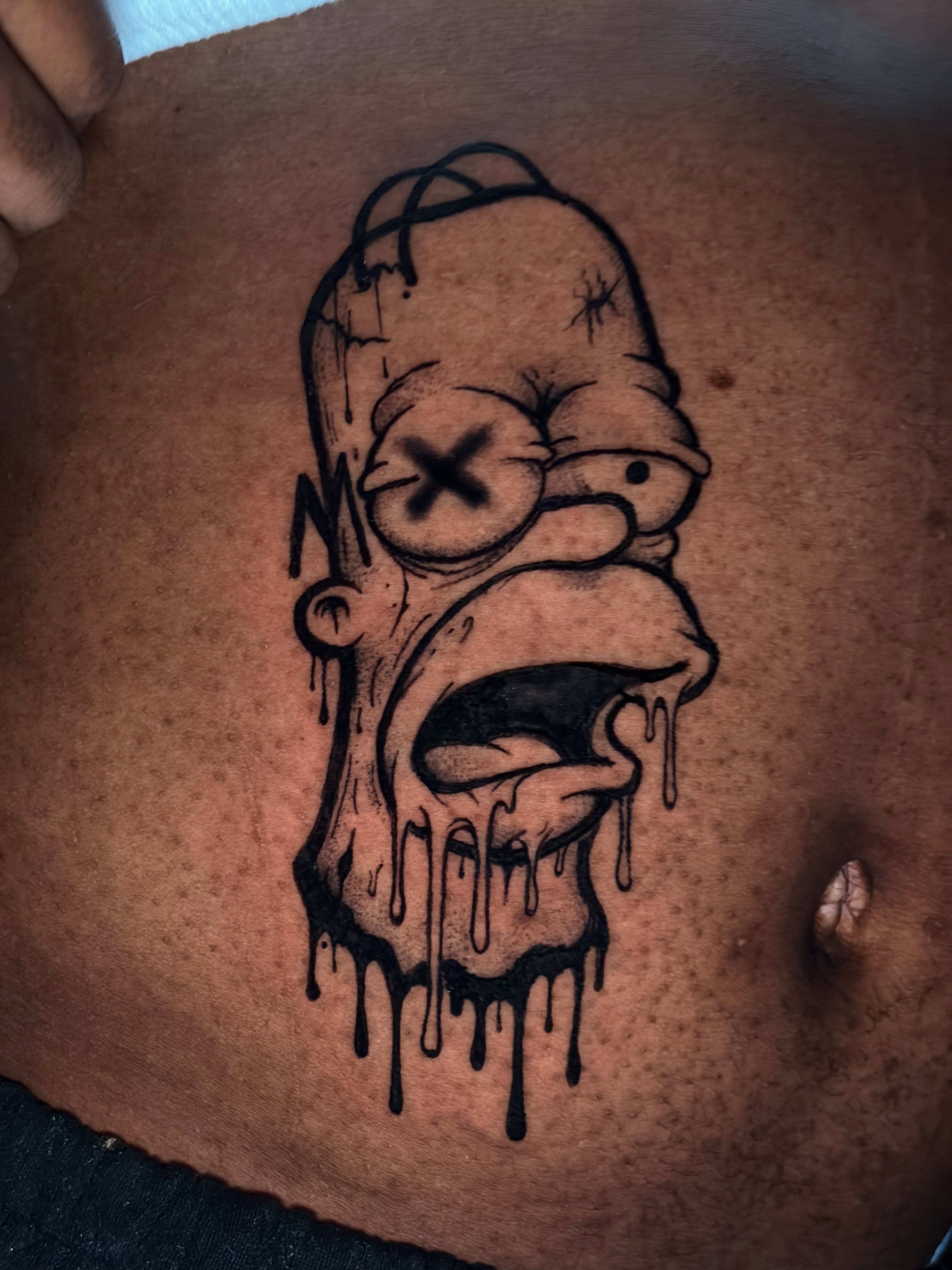 Homer simpson black and grey tattoo by @getmoneetattz