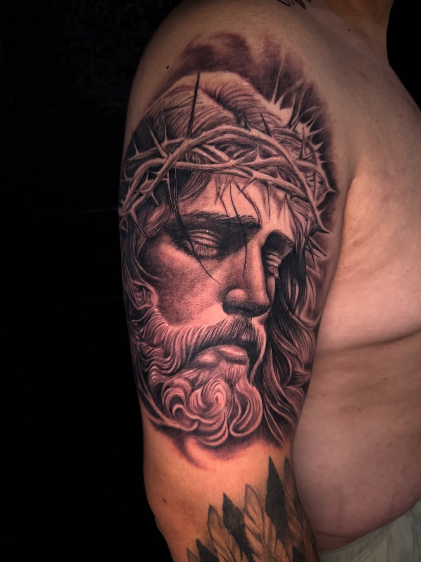 Jesus Christ realism tattoo on the shoulder by Mario Flores Tattoo