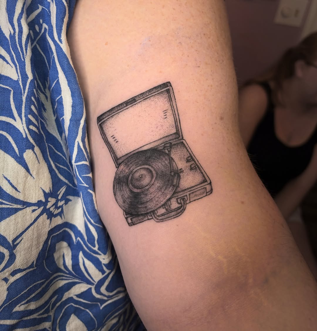 Record player dotwork tattoo on the forearm by Mary Hannah Sosdian