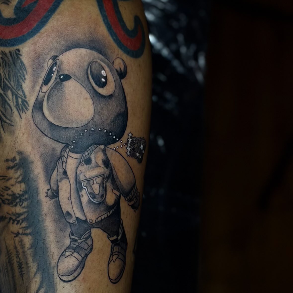 Teddy bear black and grey tattoo on the forearm by Koolz