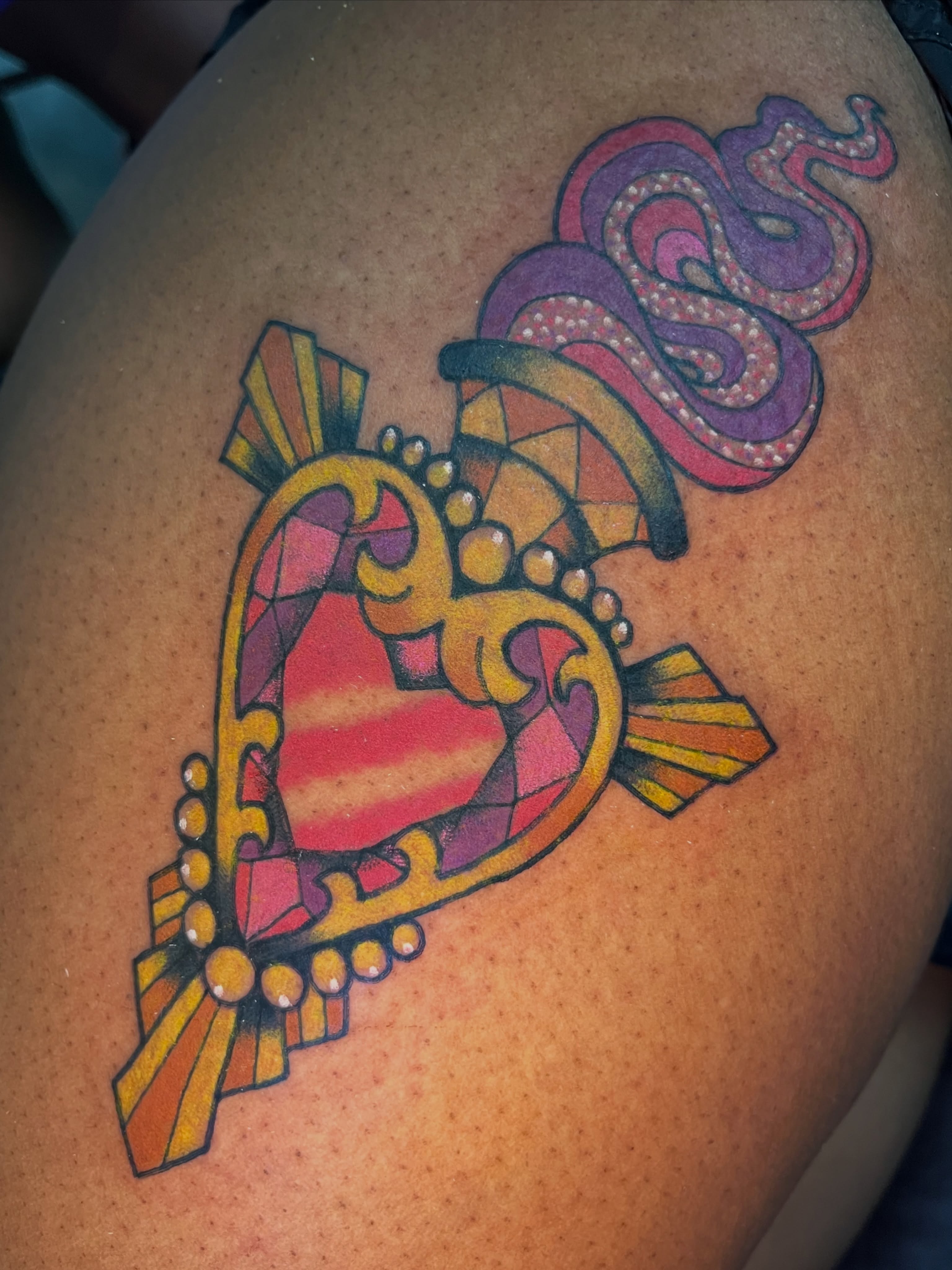 Heart with snake American traditional tattoo on the shoulder by Cincinnati Tattoo Artist, Cincinnati