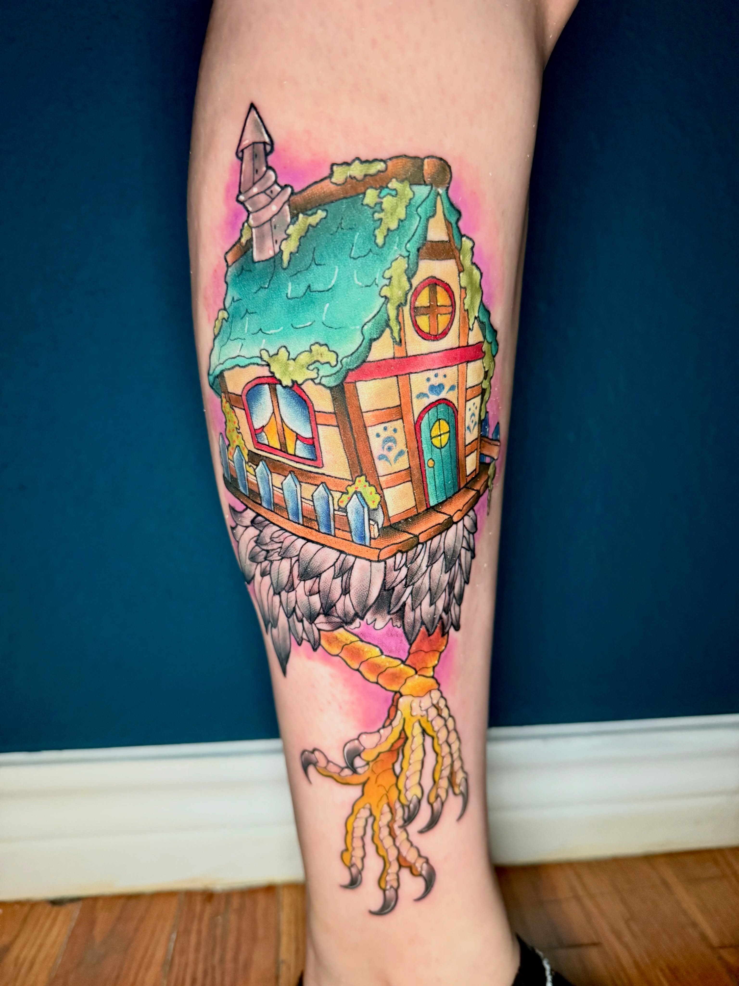 House on bird watercolor tattoo on the calf by Erin Peterson