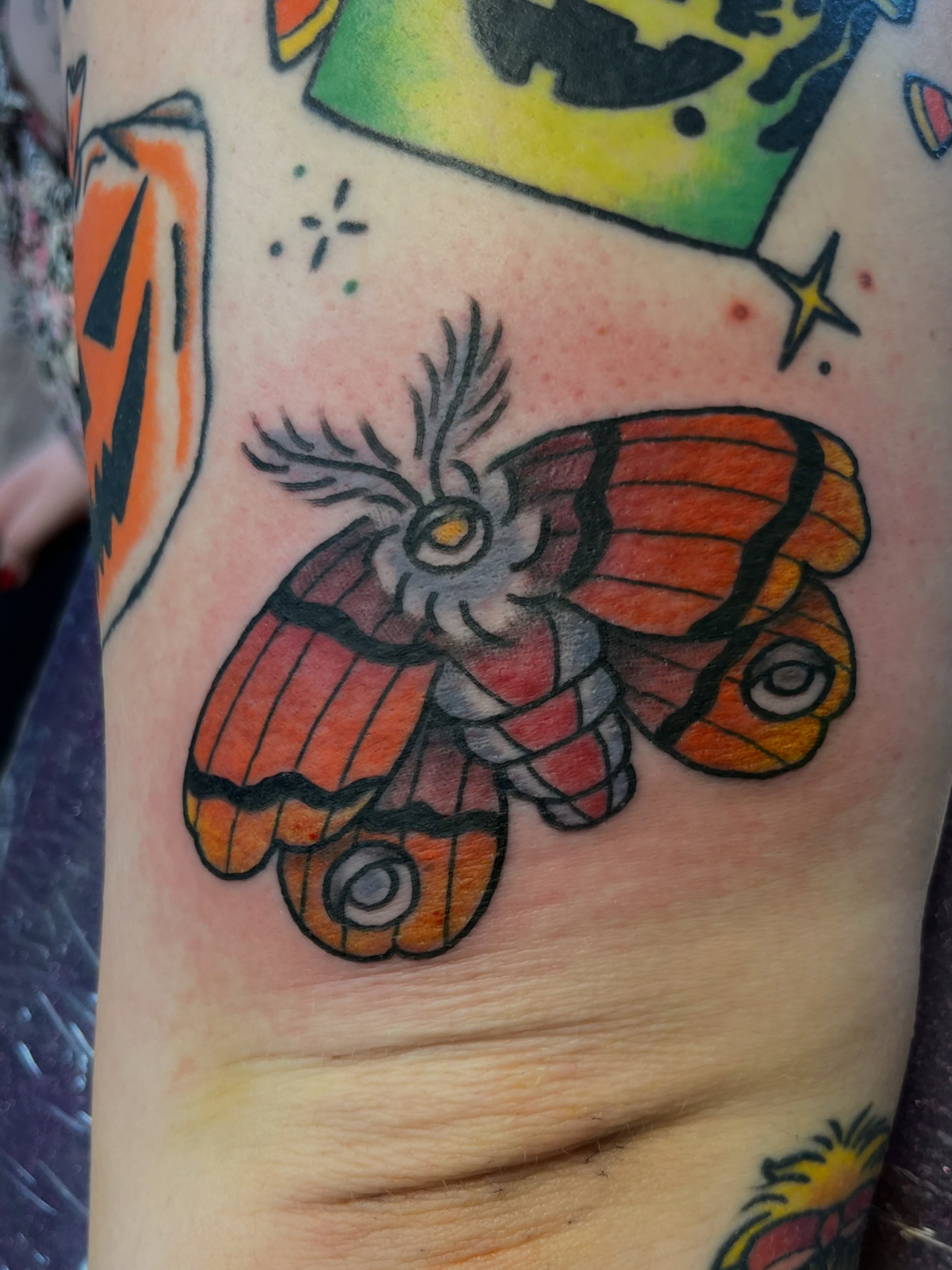 Butterfly American traditional tattoo on the forearm by Danielle Lorandeau