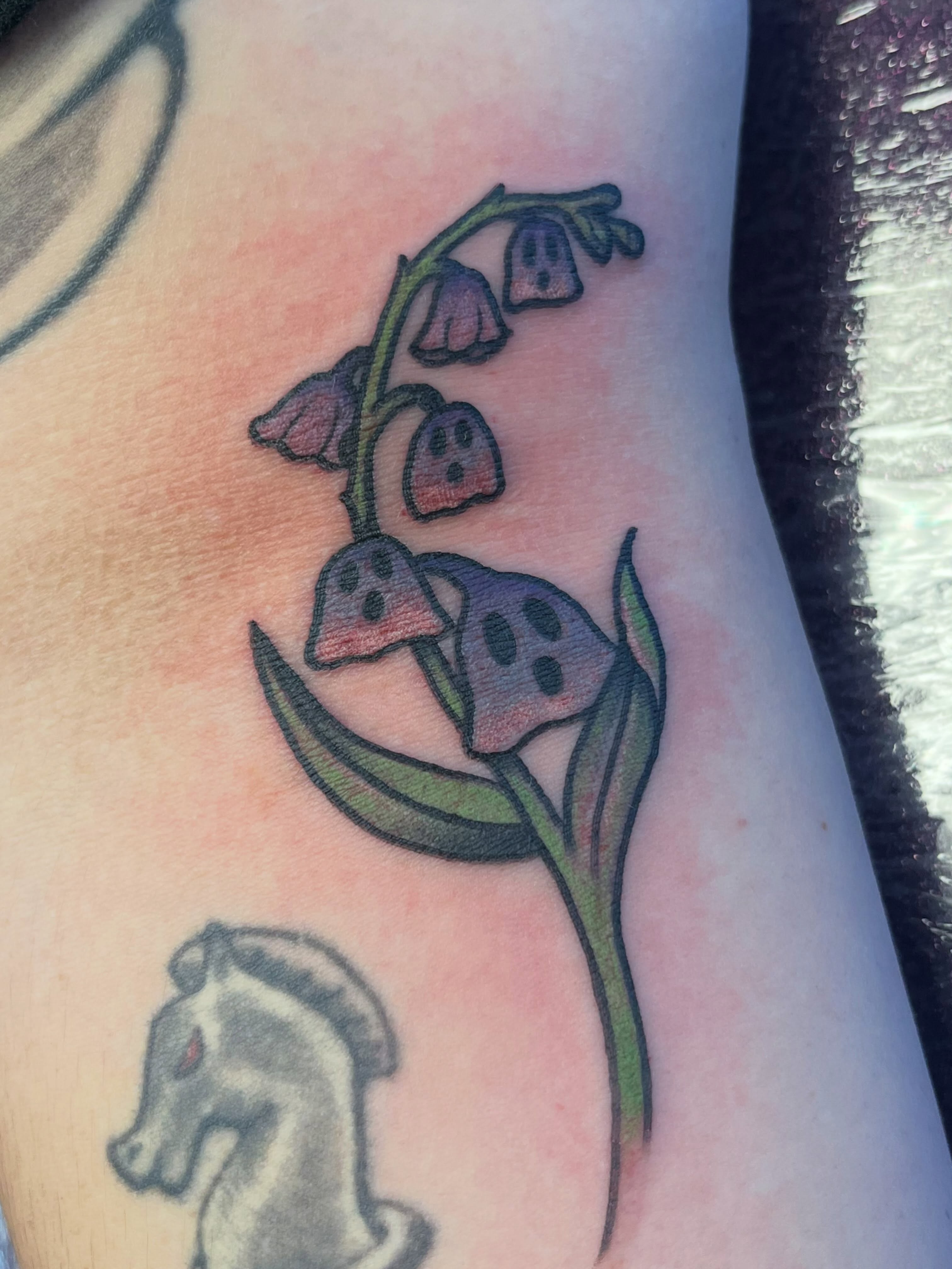 Lily of the valley watercolor tattoo on the forearm by Danielle Lorandeau