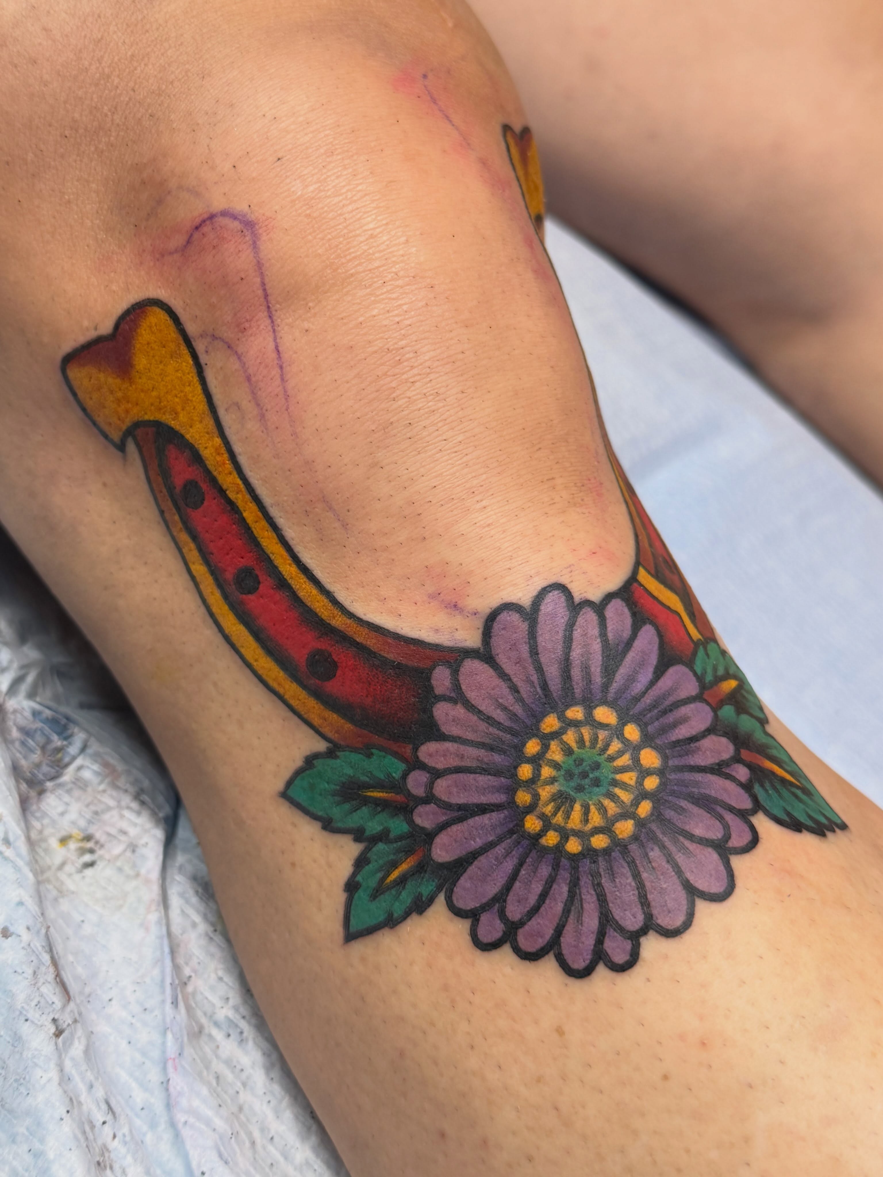 Horseshoe and flower American traditional tattoo on the forearm by KevinBetsch