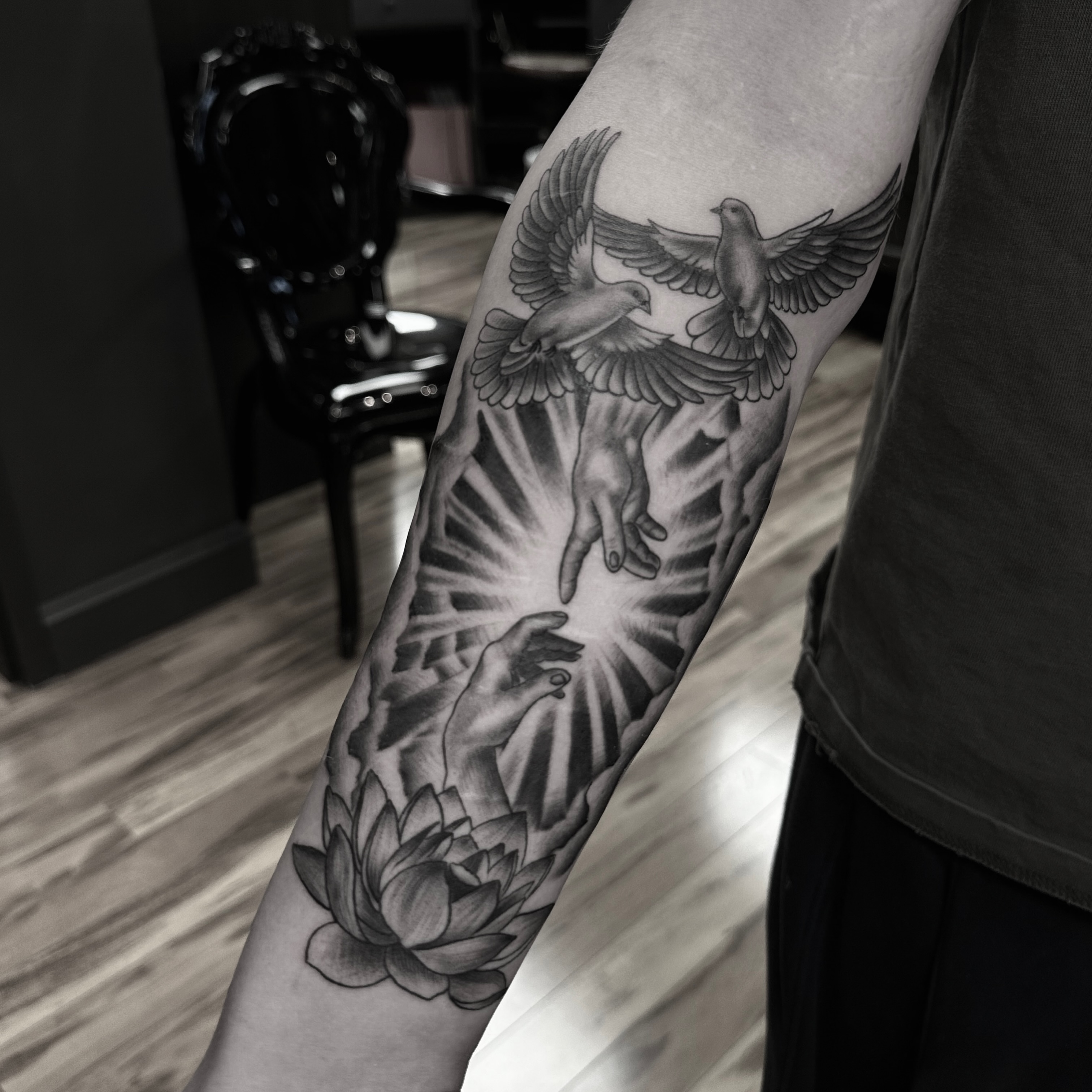 Hands reaching towards birds realism tattoo on the forearm by Leo Fernandes, Danvers, Massachusetts