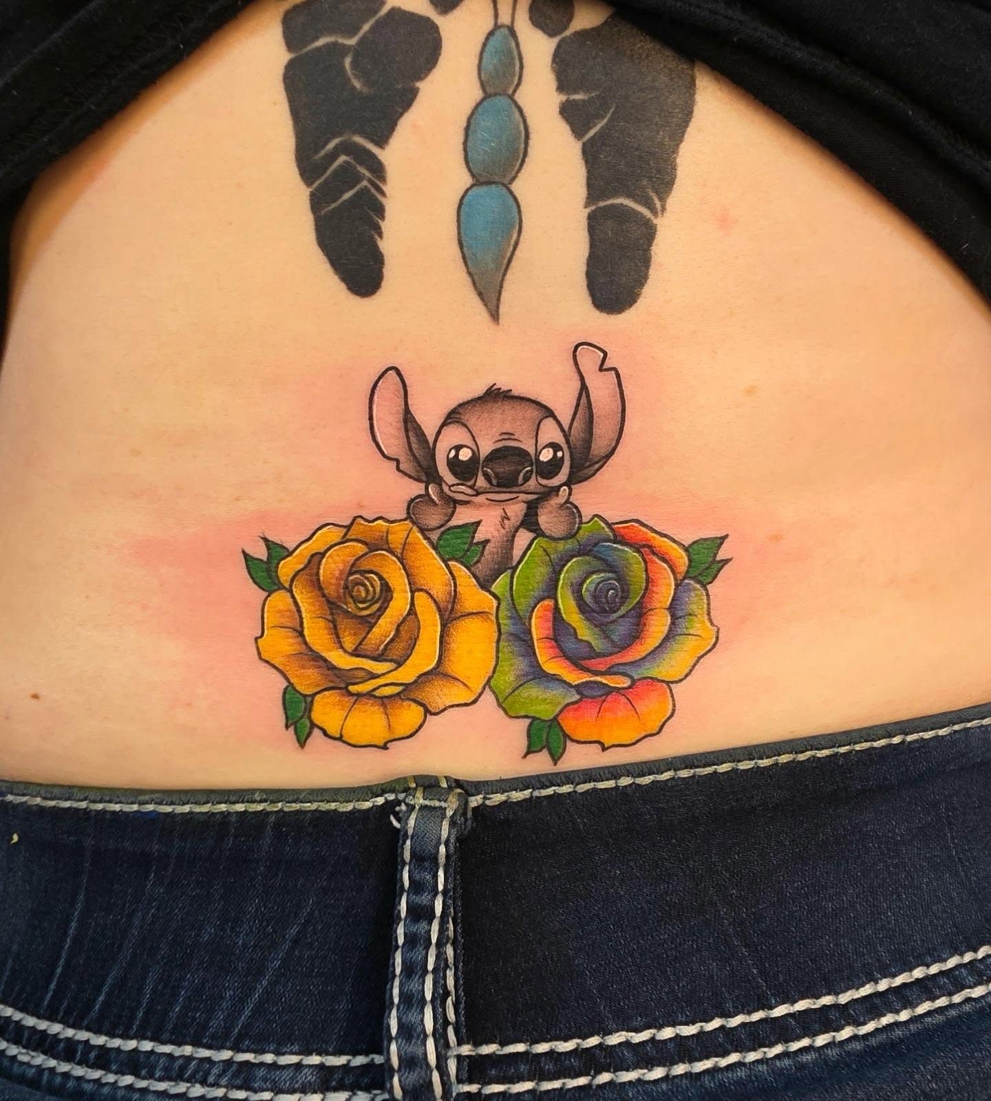 Stitch and roses new school tattoo on the thigh by Danielle Elizabeth