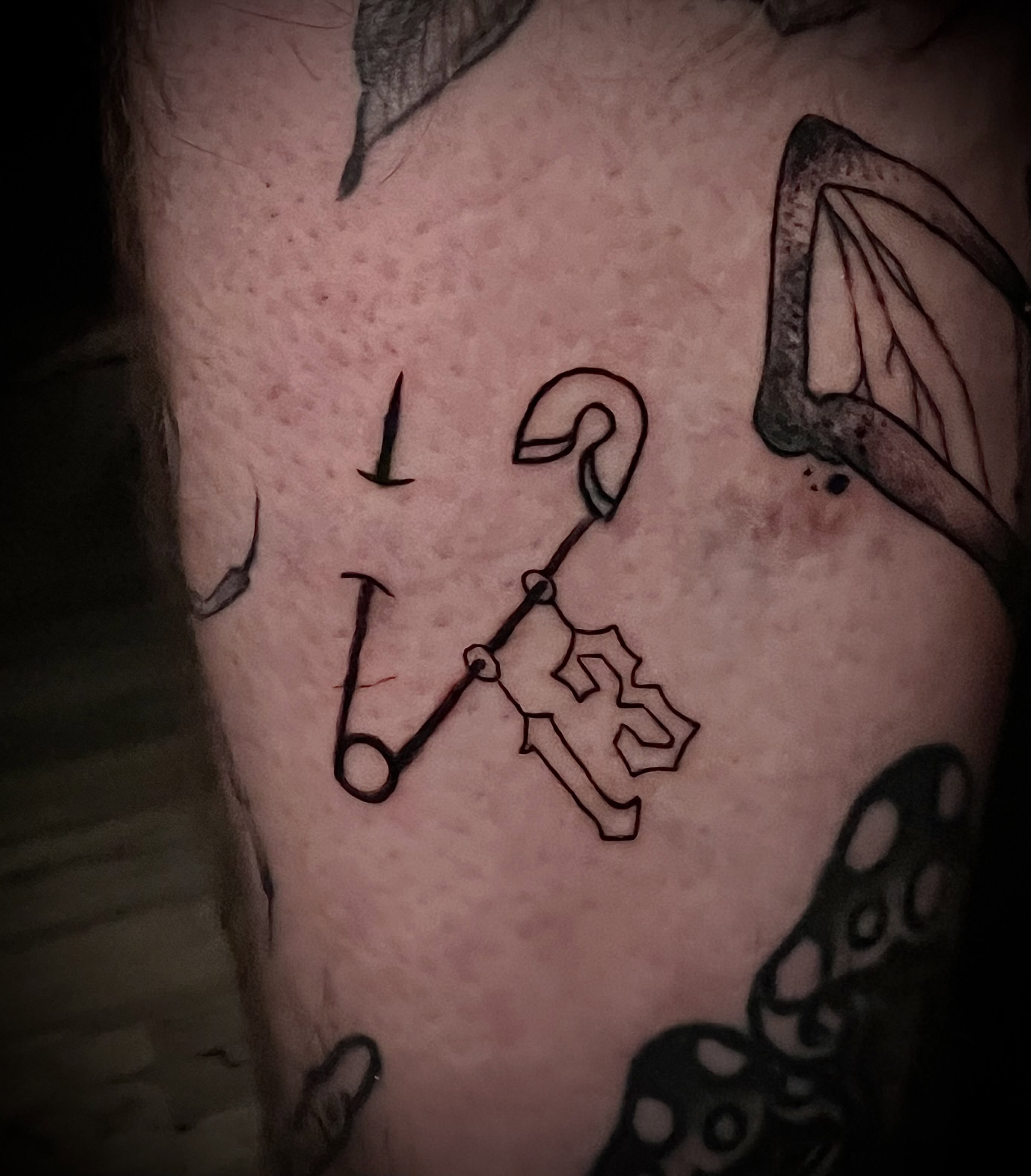 Anchor and hook black and grey tattoo on the chest by James Richardson